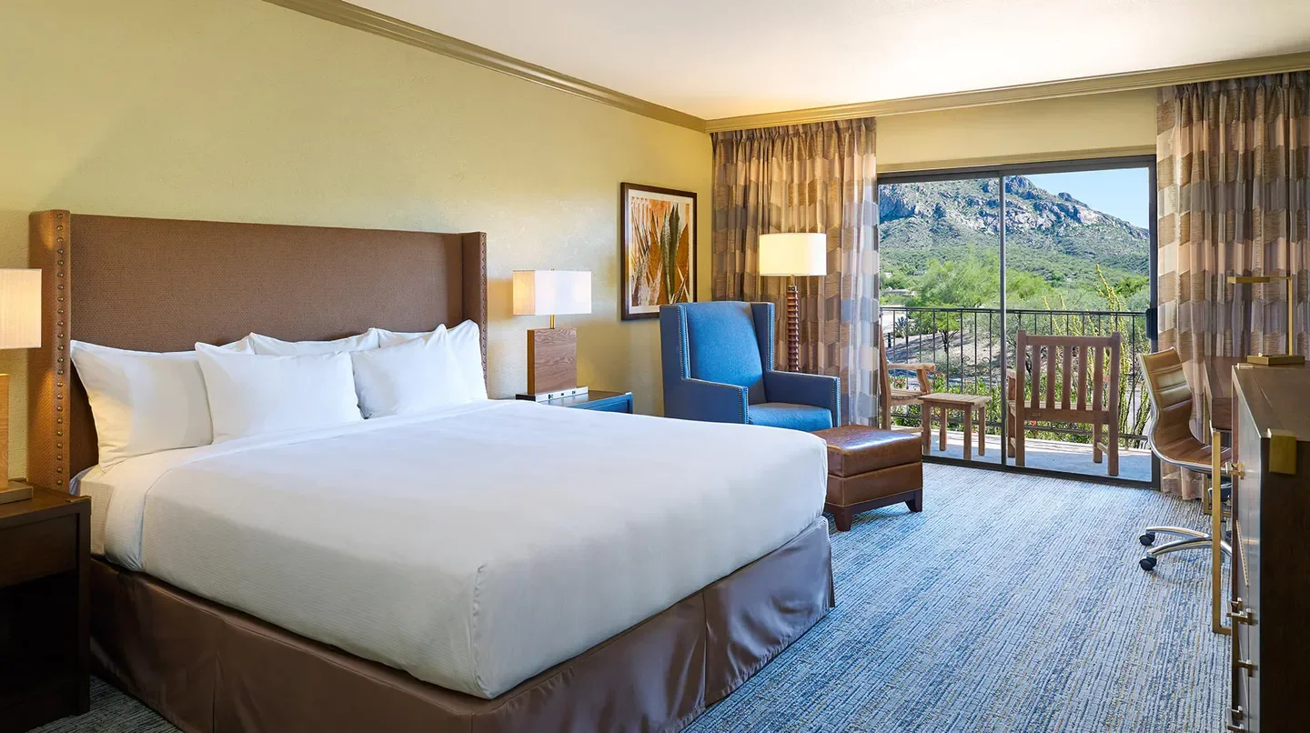 Spacious bedroom at El Conquistador Tucson, A Hilton Resort in Tucson with mountain views.