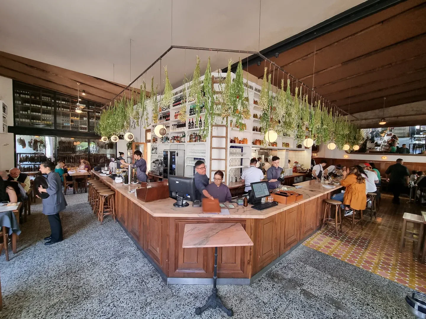 Interior of El Preferido de Palermo in Buenos Aires, featuring bar and stylish decor.