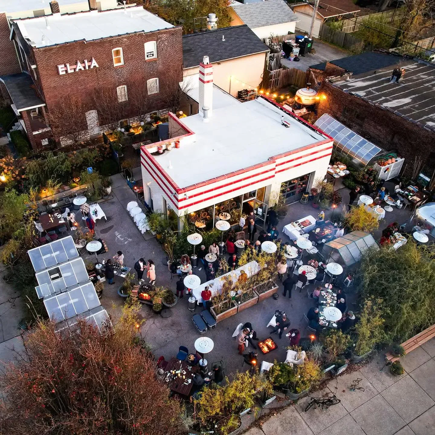 Aerial view of ELAIA restaurant in St. Louis with outdoor seating and dining.