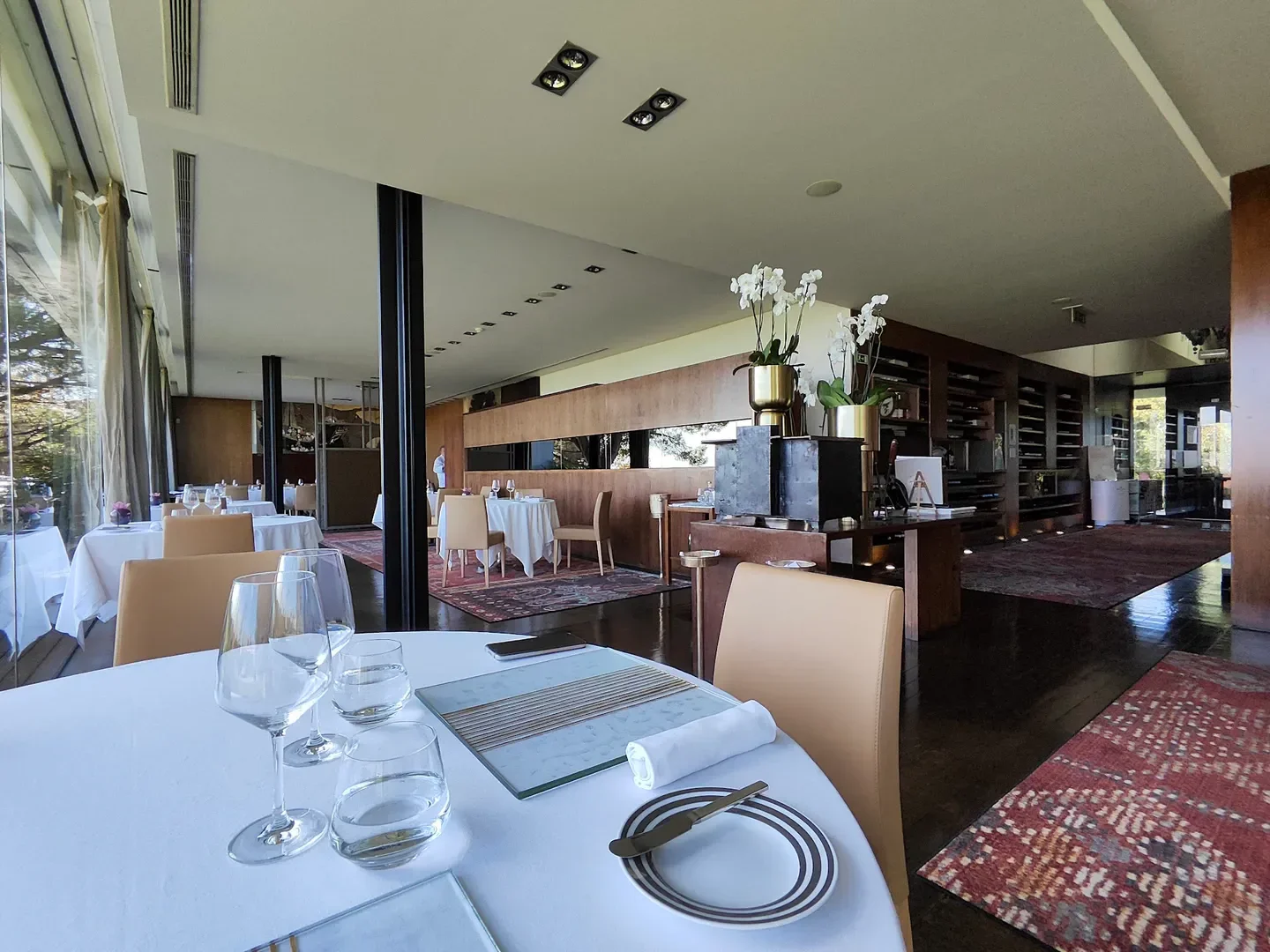 Elegant interior of Eleven restaurant in Lisbon, showcasing stylish dining tables and decor.