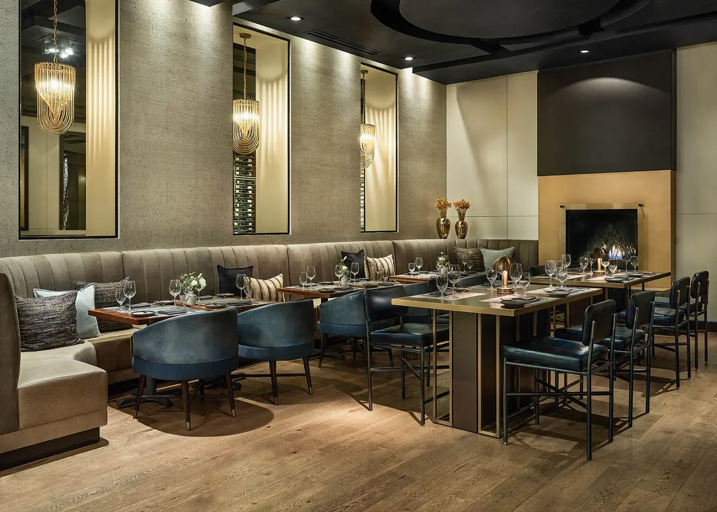 Interior of Elway's Downtown in Denver, featuring cozy seating and fireplace ambiance.