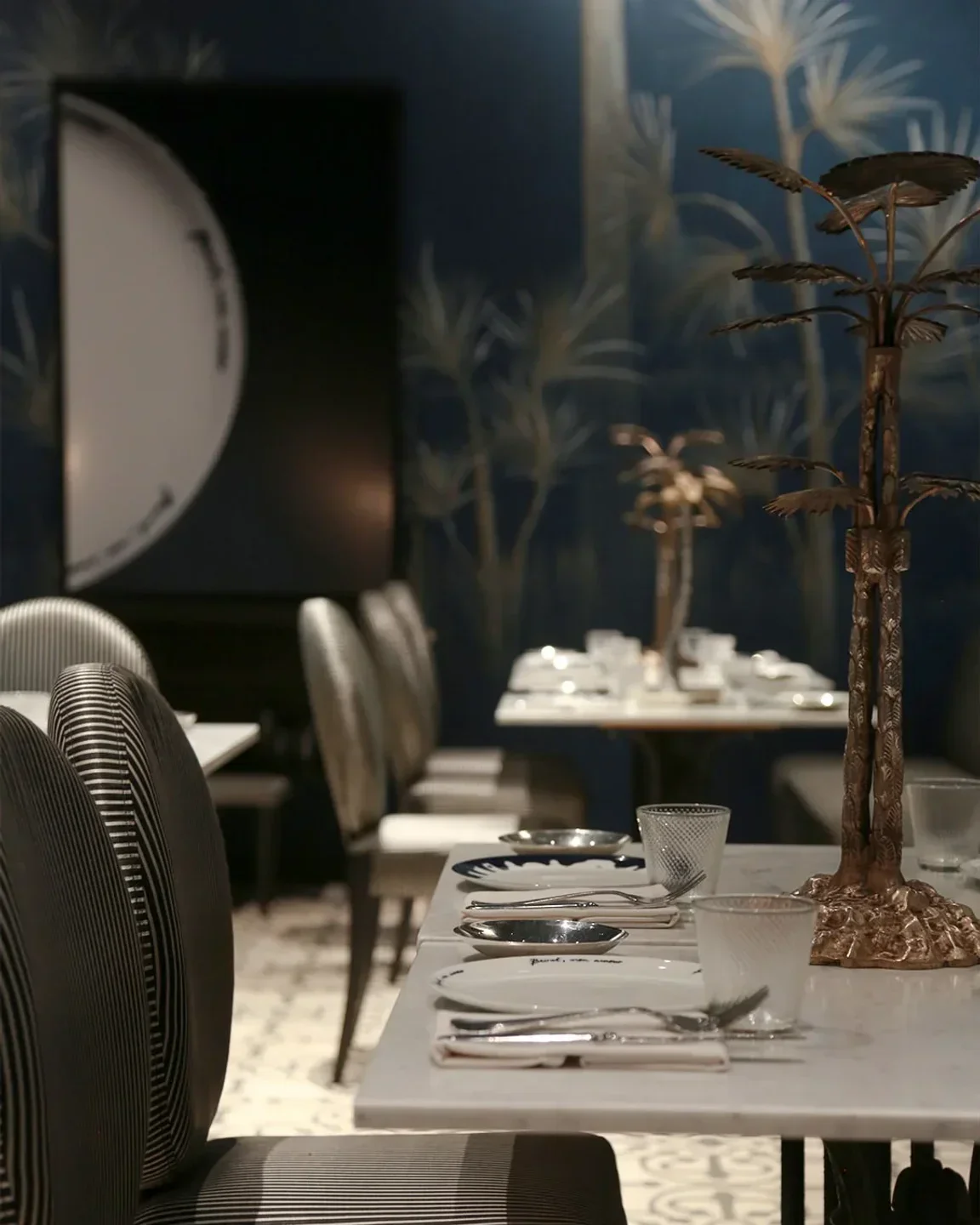 Elegant dining interior at Em Sherif in Beirut with stylish table setting.