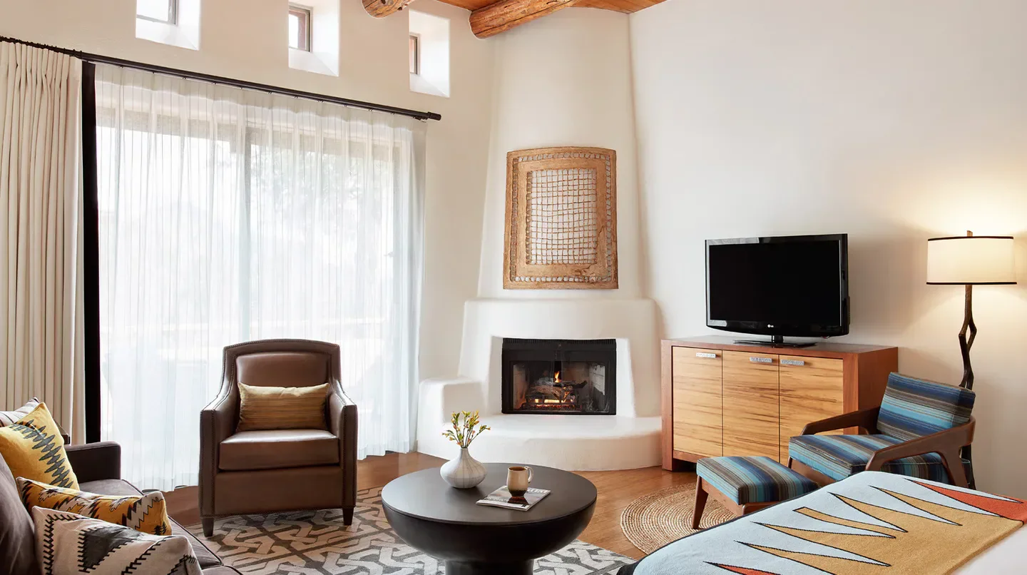 Cozy living space at Enchantment Resort in Sedona with fireplace and stylish decor.