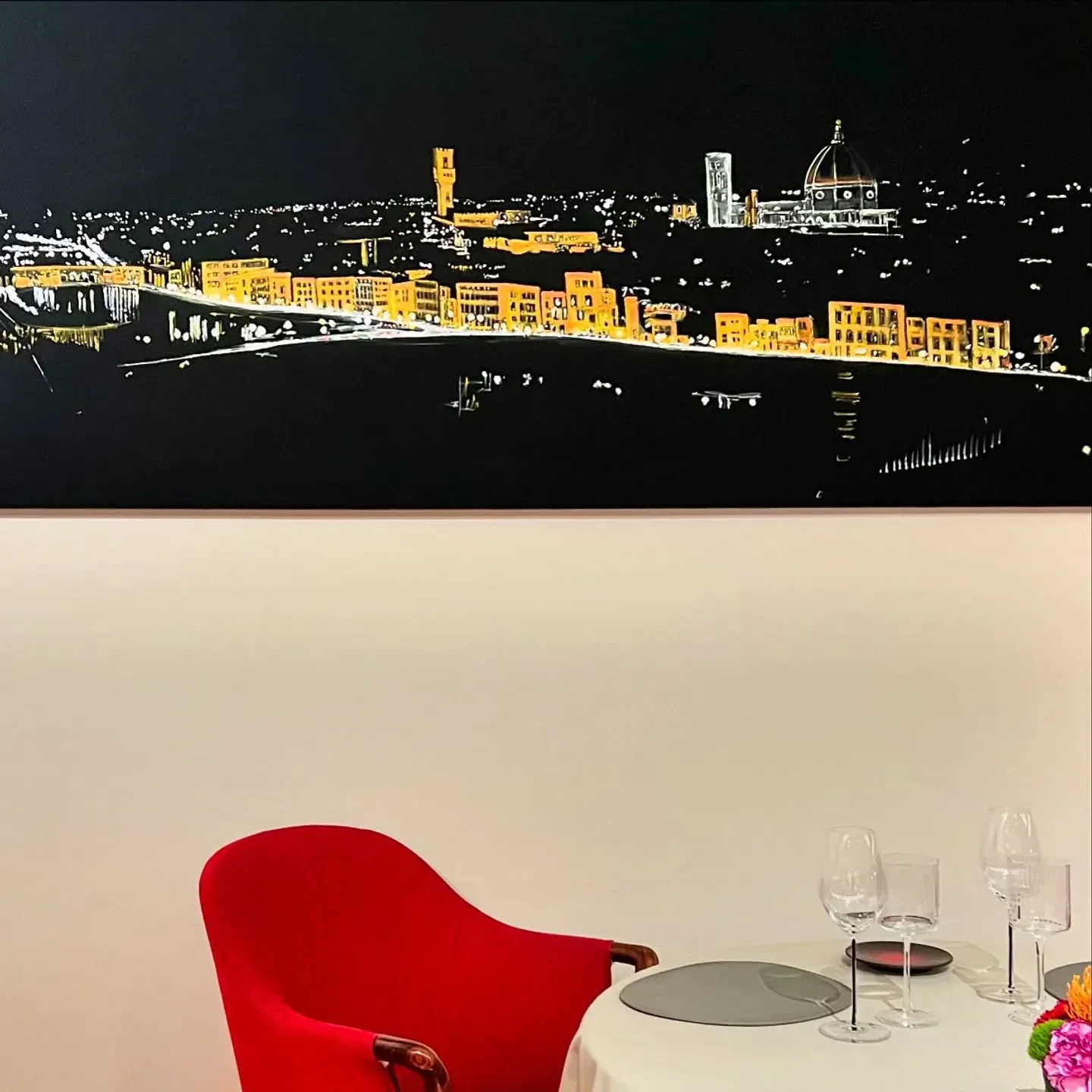 Enoteca Pinchiorri in Florence with an art piece of the city skyline