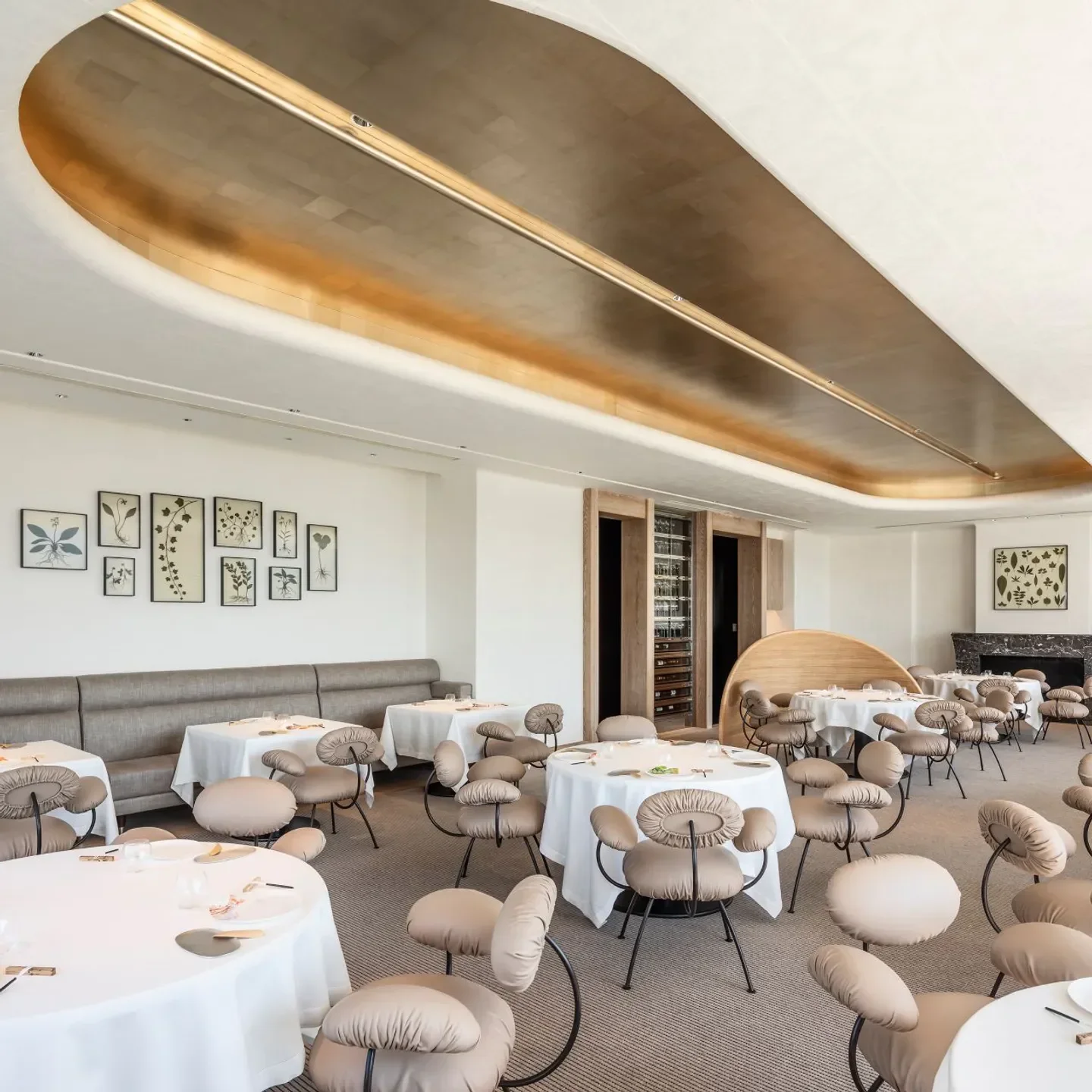 Interior of ESTERRE restaurant in Tokyo with elegant decor and unique seating.