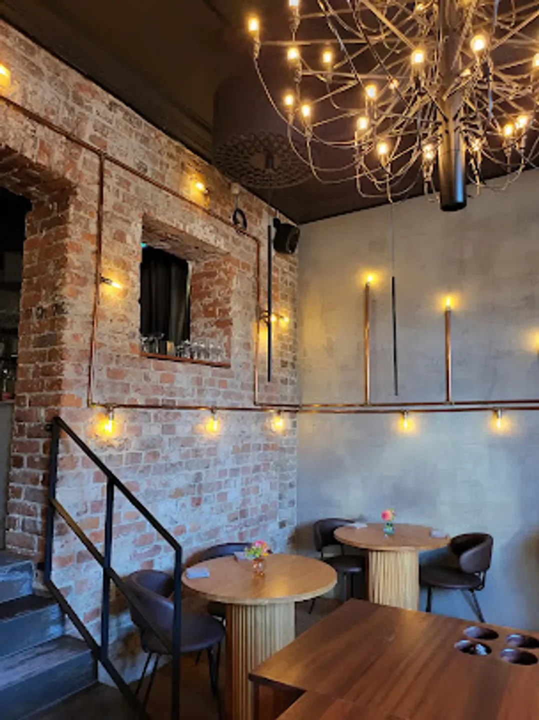Interior of Etoile restaurant in Stockholm with brick wall and unique lighting