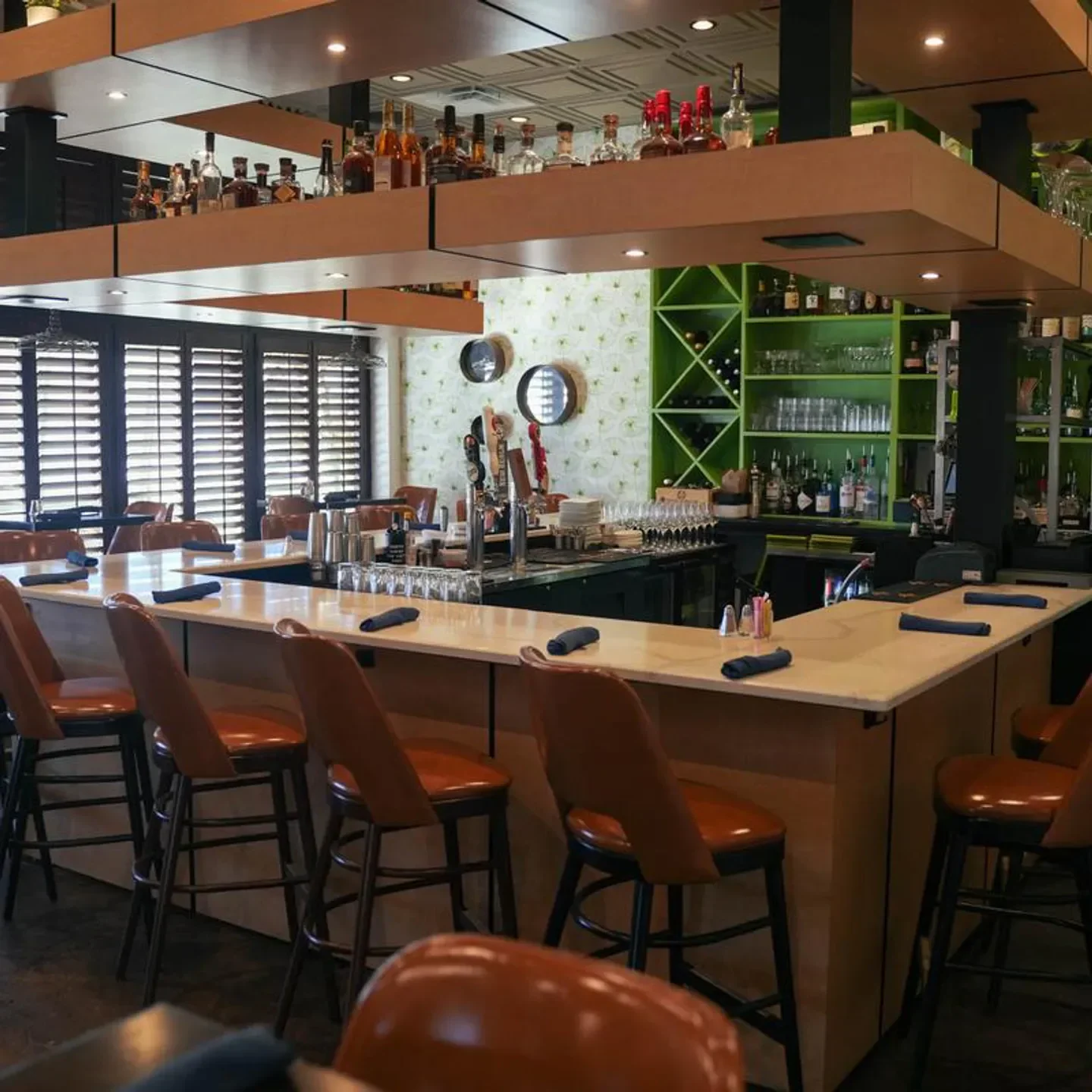 Interior bar at Eurasia Cafe in Virginia Beach, featuring stylish seating and drink selection.