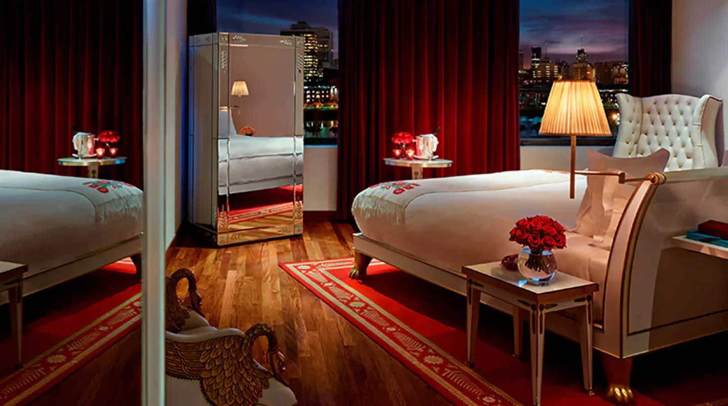 Luxury bedroom at Faena Buenos Aires hotel in Buenos Aires, featuring city views.