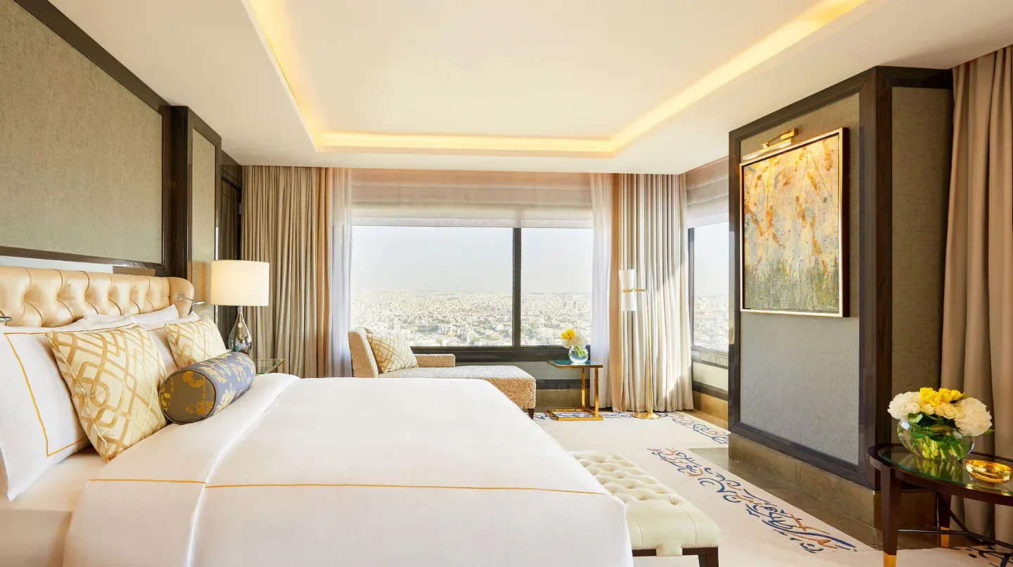 Luxury bedroom at Fairmont Amman with stunning city views of Amman, Jordan.
