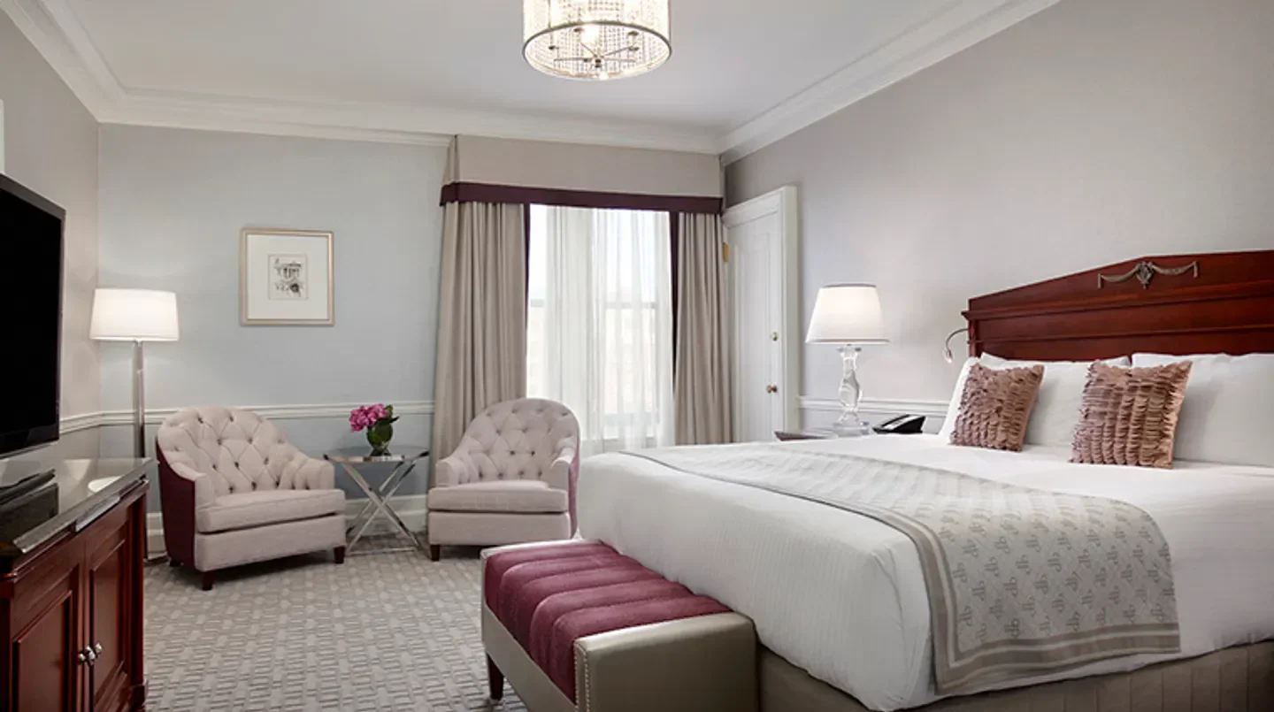 Elegant bedroom at the Fairmont Copley Plaza in Boston, featuring luxurious furnishings and decor.