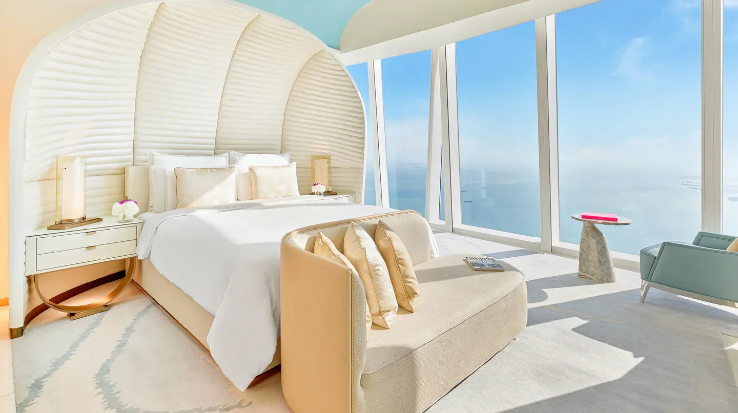 Luxury bedroom at Fairmont Doha with stunning views over Doha, Qatar.