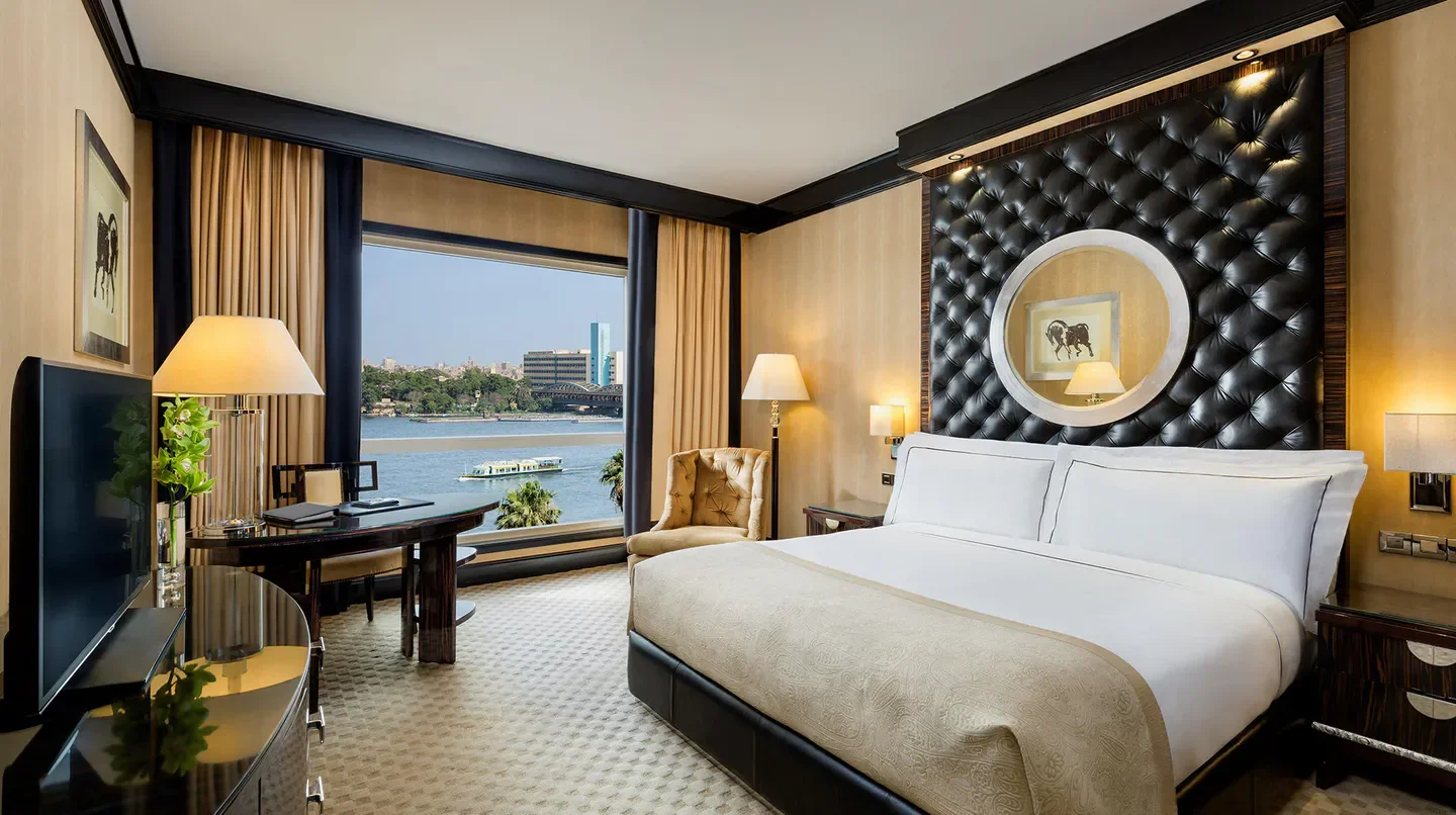 Luxury room at Fairmont Nile City, Cairo, with Nile River view and elegant decor.