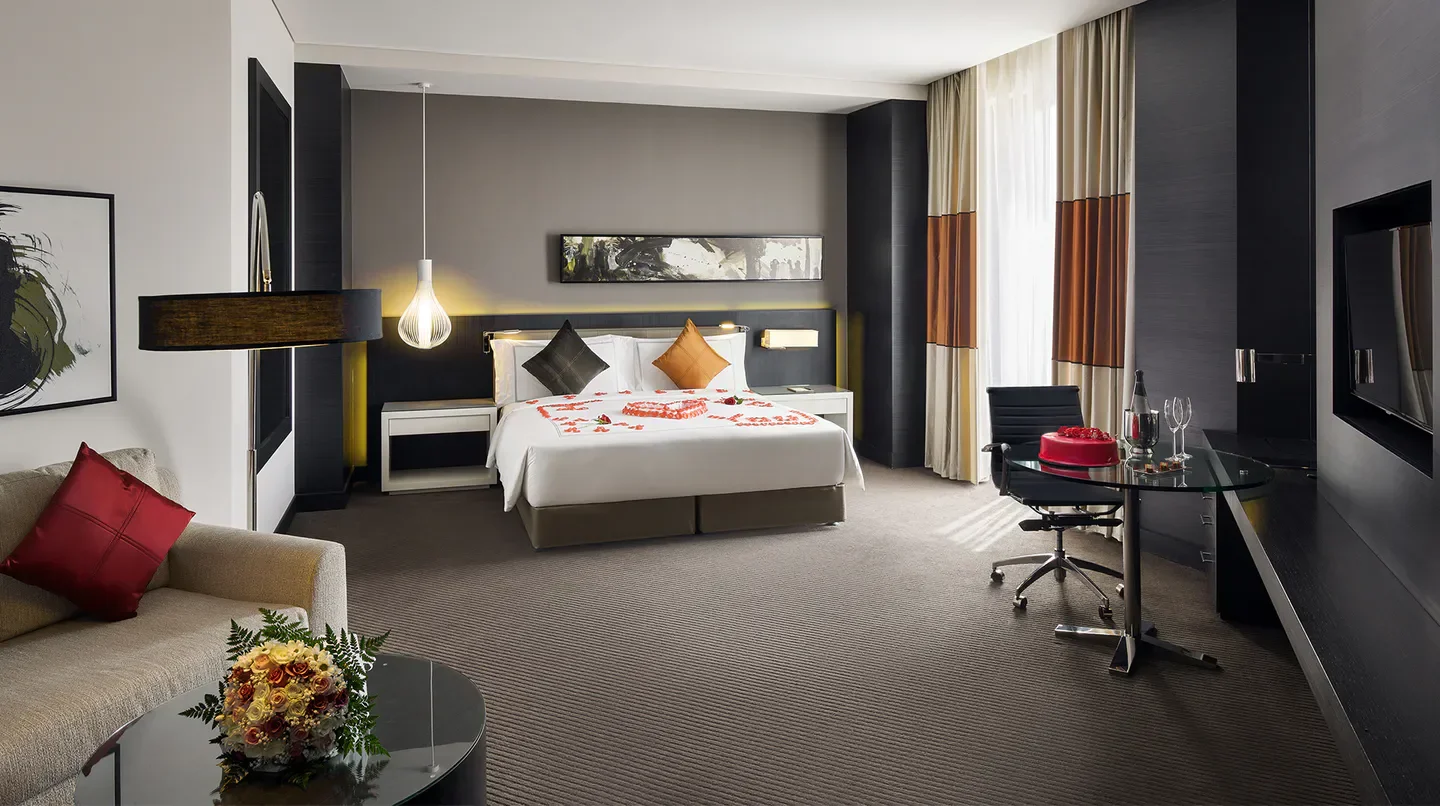 Luxury suite at Fairmont Riyadh hotel, featuring romantic decor and views of Riyadh.