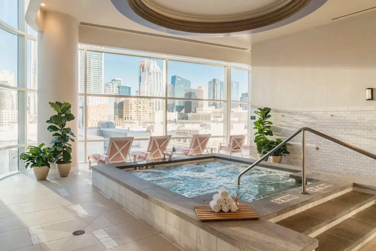 Fairmont Spa Austin spa with a jacuzzi and city views of Austin, Texas.
