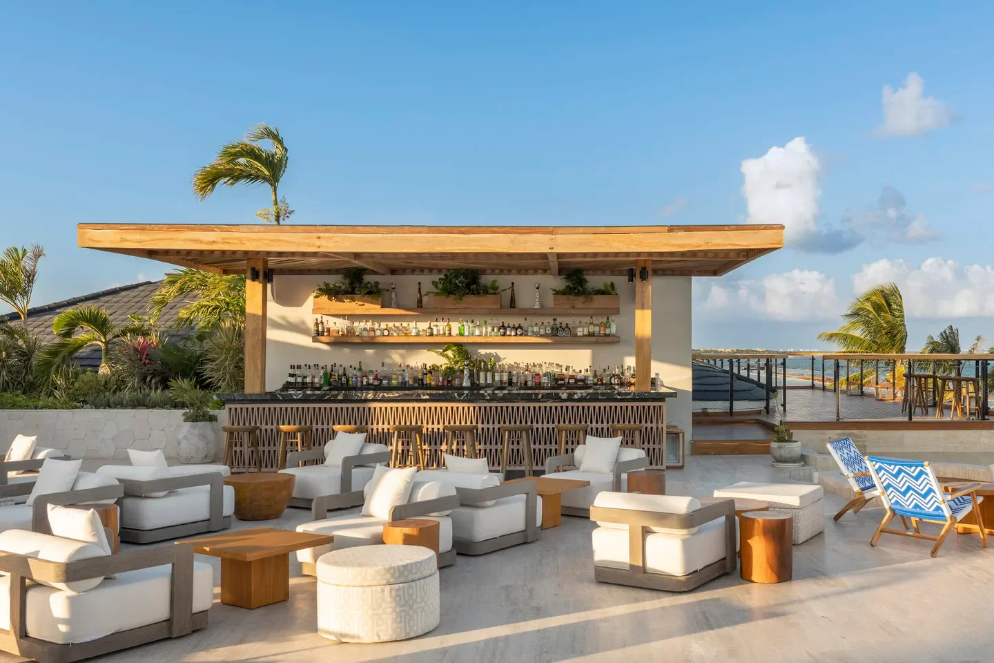 Rooftop bar at Fairmont Spa Mayakoba in Riviera Maya with comfortable seating and ocean views