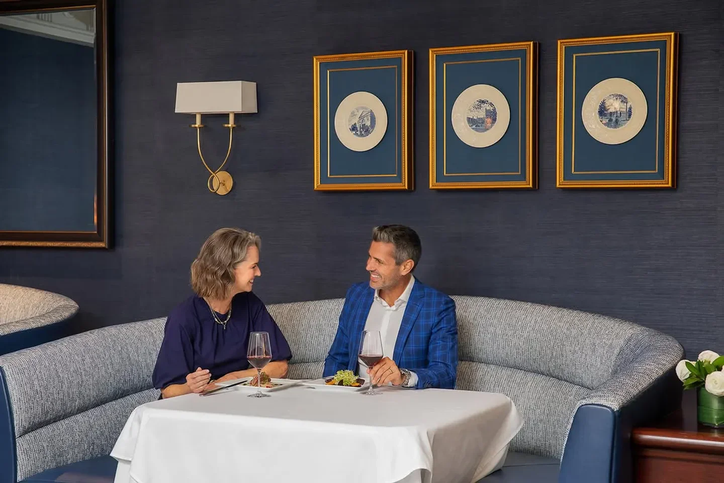Couple dining at Fairview Dining Room in Durham, enjoying wine and conversation.