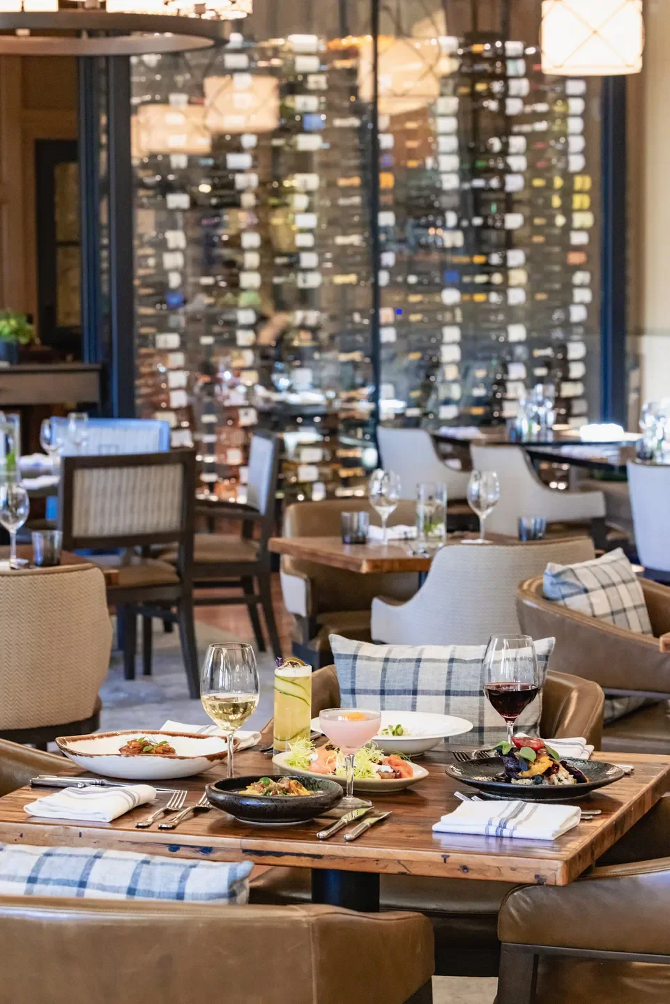 Table setting at FARM in Napa with wine glasses and gourmet dishes.