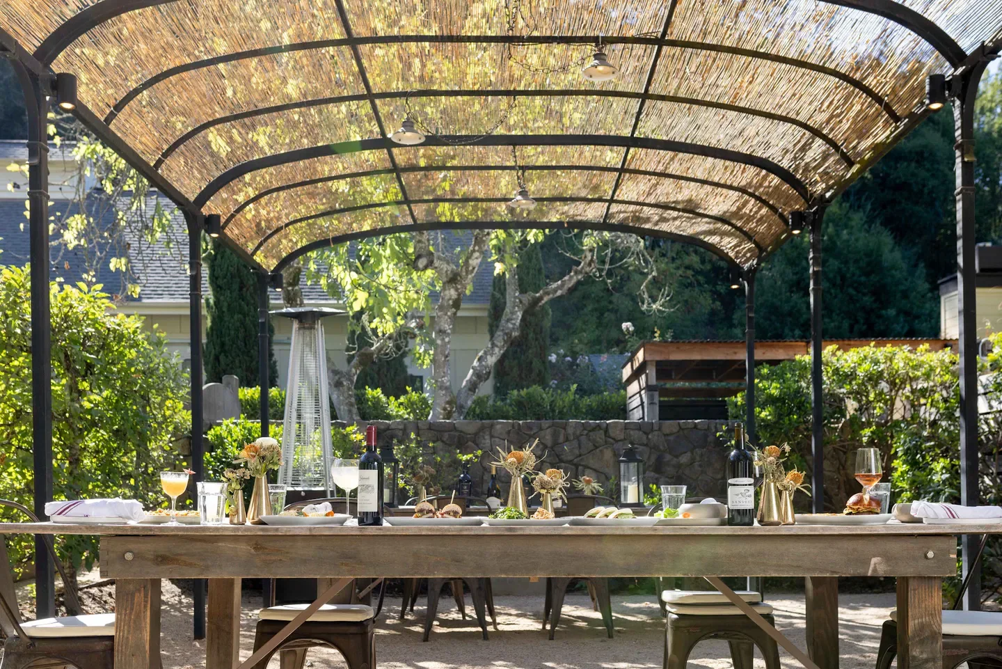 Outdoor dining at Farmhouse Inn Restaurant in Healdsburg, California, with a rustic, elegant ambiance.
