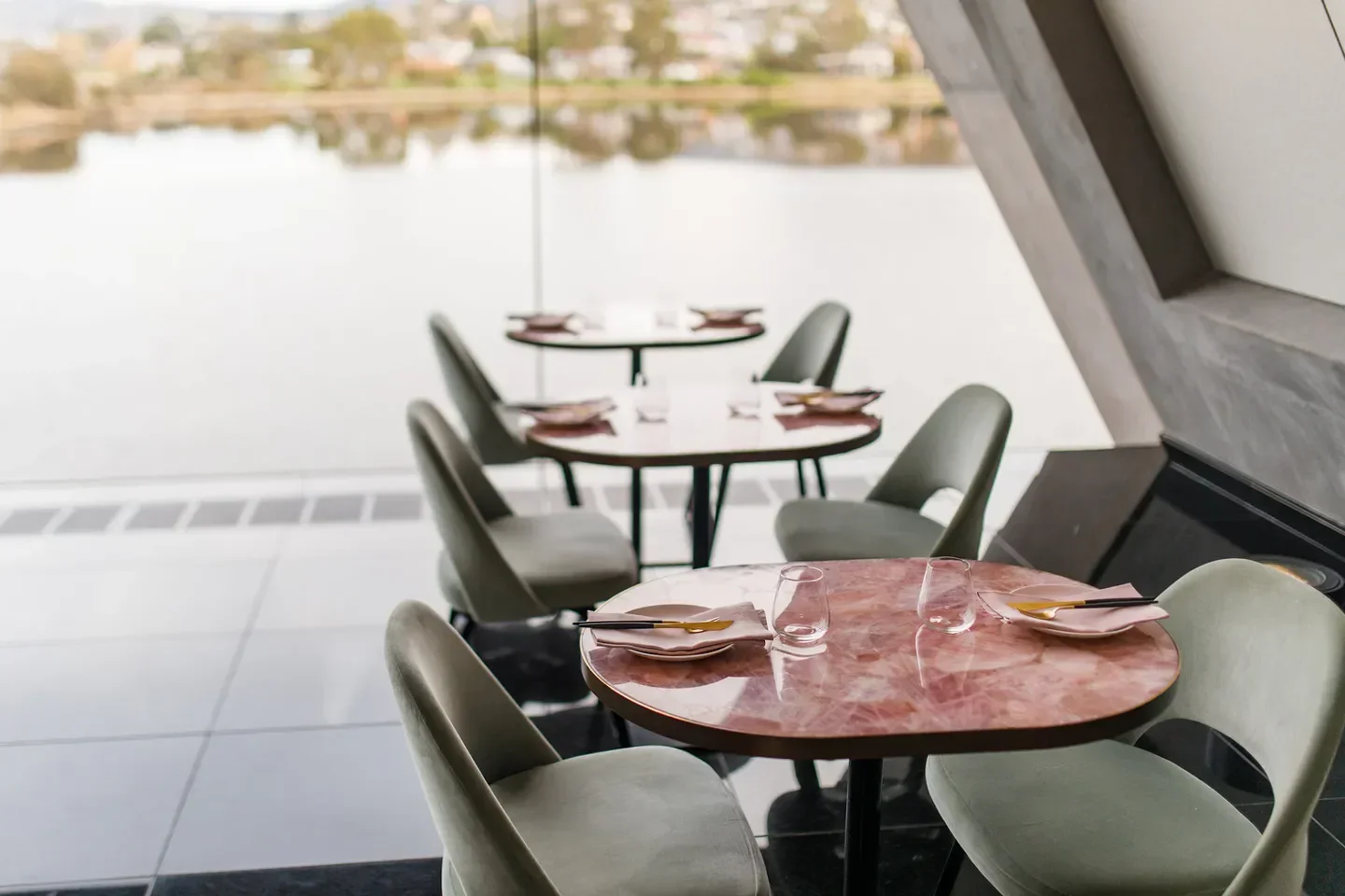 Stylish interior dining at FARO at MONA restaurant, Hobart, overlooking water views.