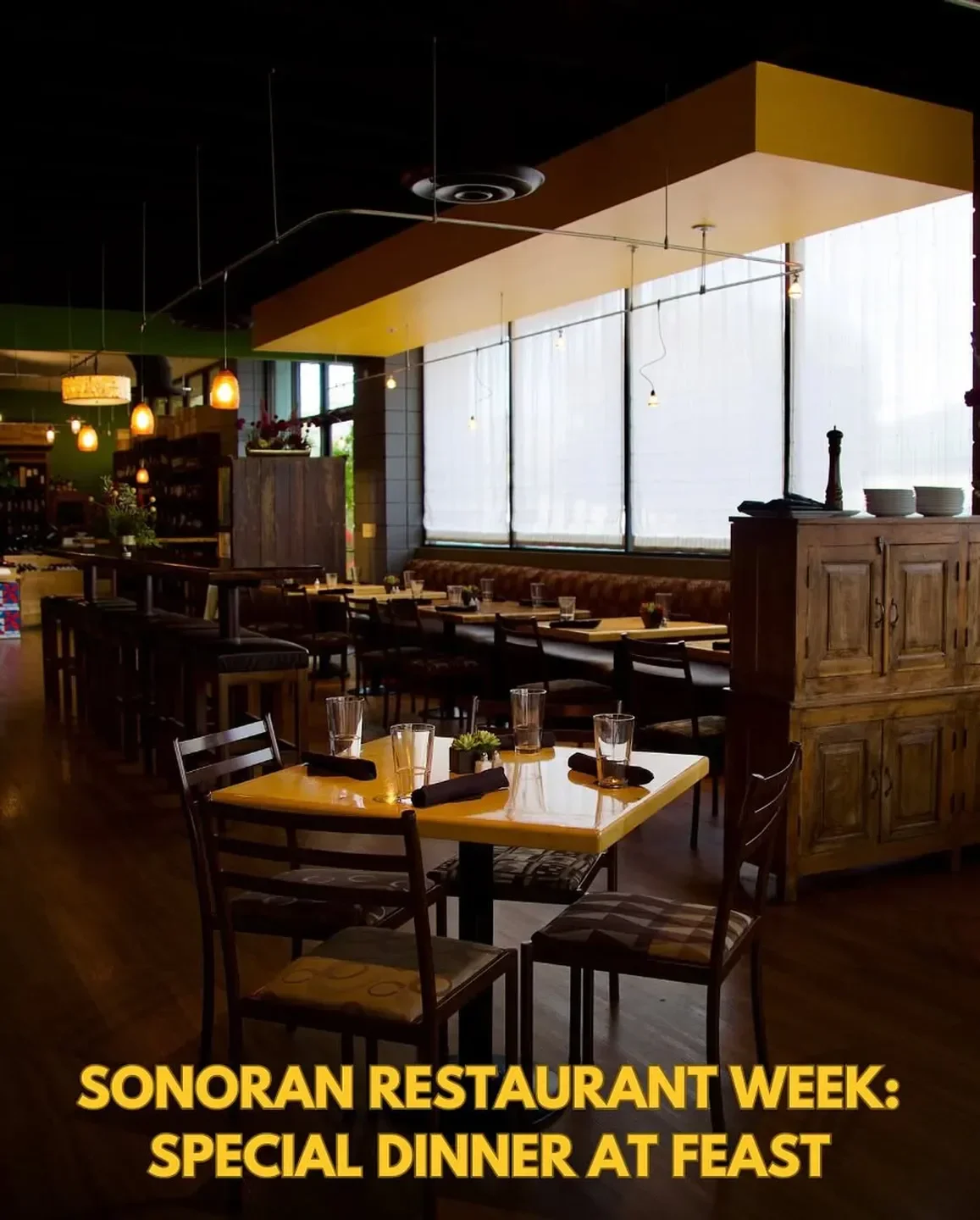 Cozy dining area at Feast restaurant in Tucson, featuring tables and warm lighting.