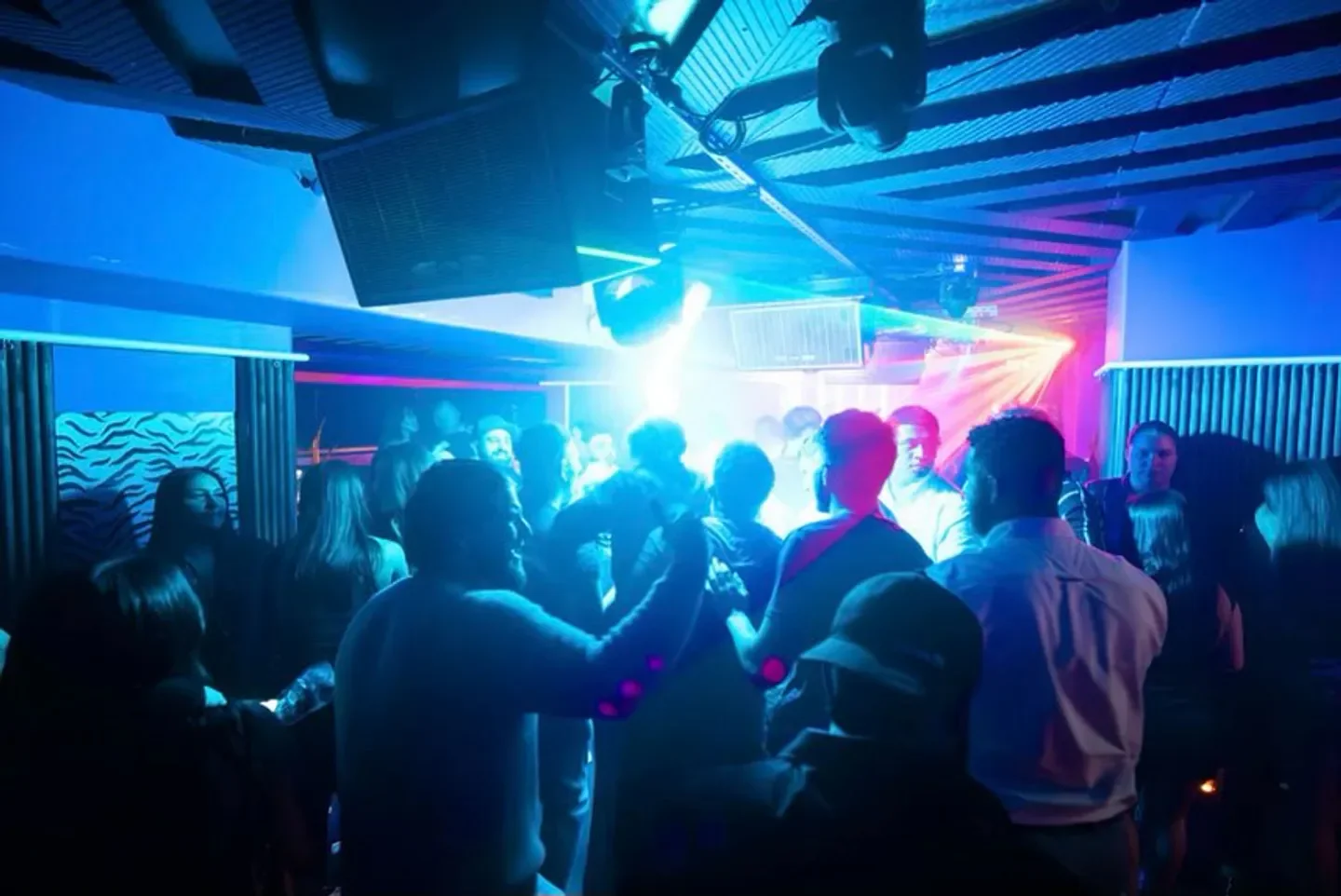 Energetic crowd enjoying a night out at Flamingo Lounge, a popular nightclub in Sydney.