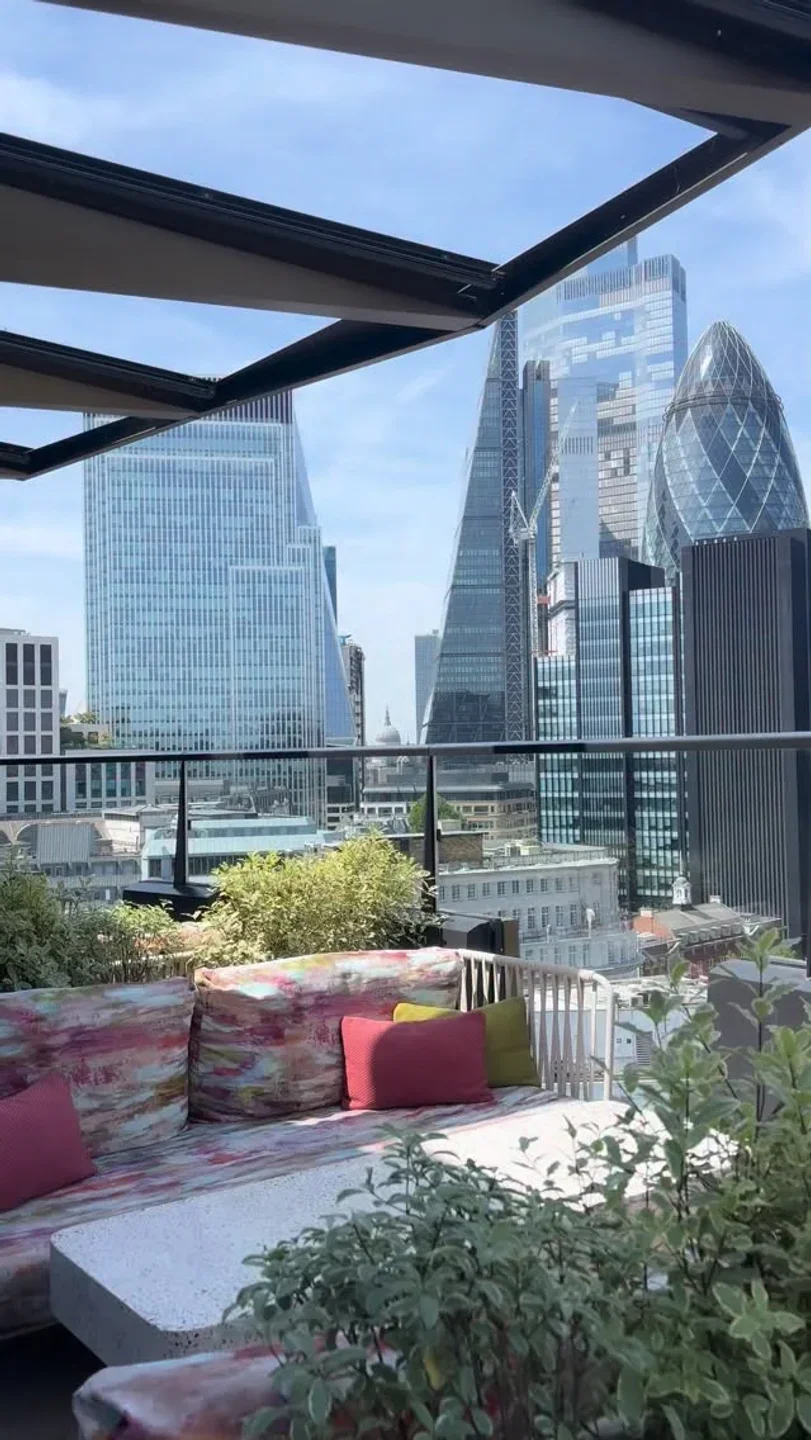 Florattica rooftop lounge with London skyline view, featuring Gherkin building.