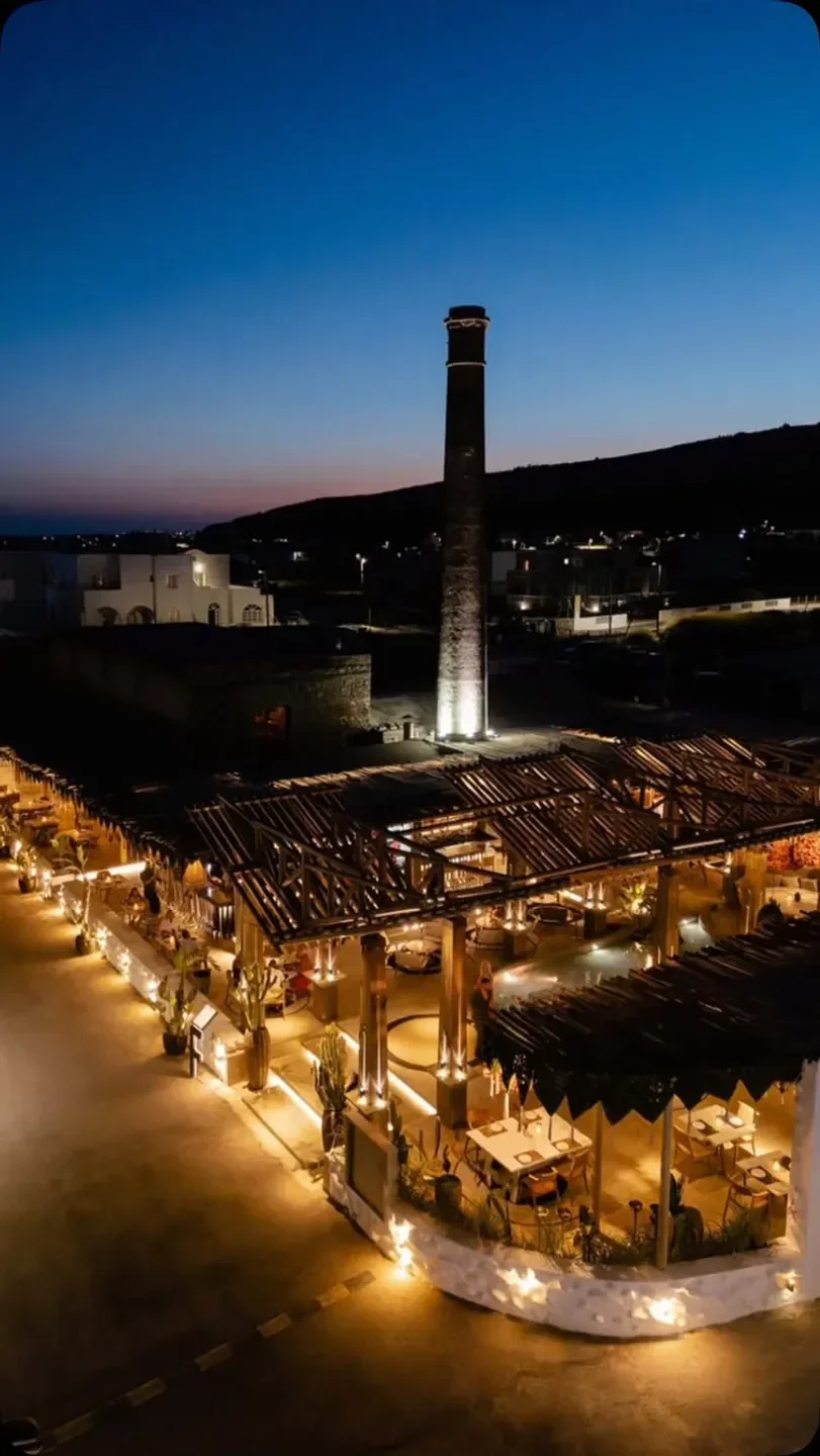 Forty One restaurant in Santorini, illuminated at night with a unique architectural design.