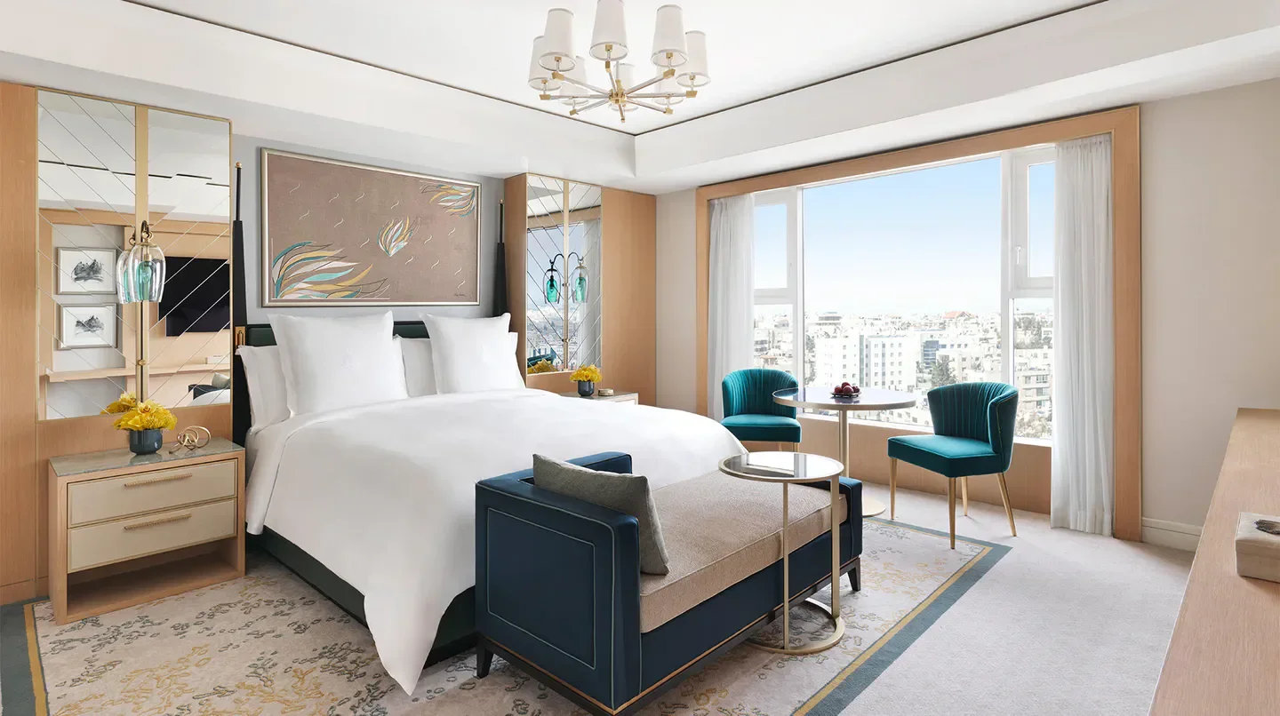 Elegant bedroom at the Four Seasons Hotel Amman, with city views in Amman, Jordan.