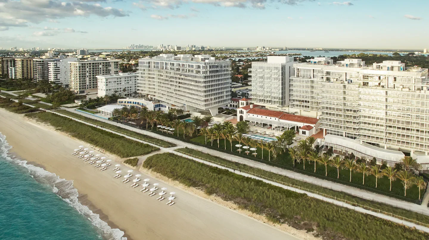 Aerial view of Four Seasons Hotel at The Surf Club in Miami, overlooking the beach.