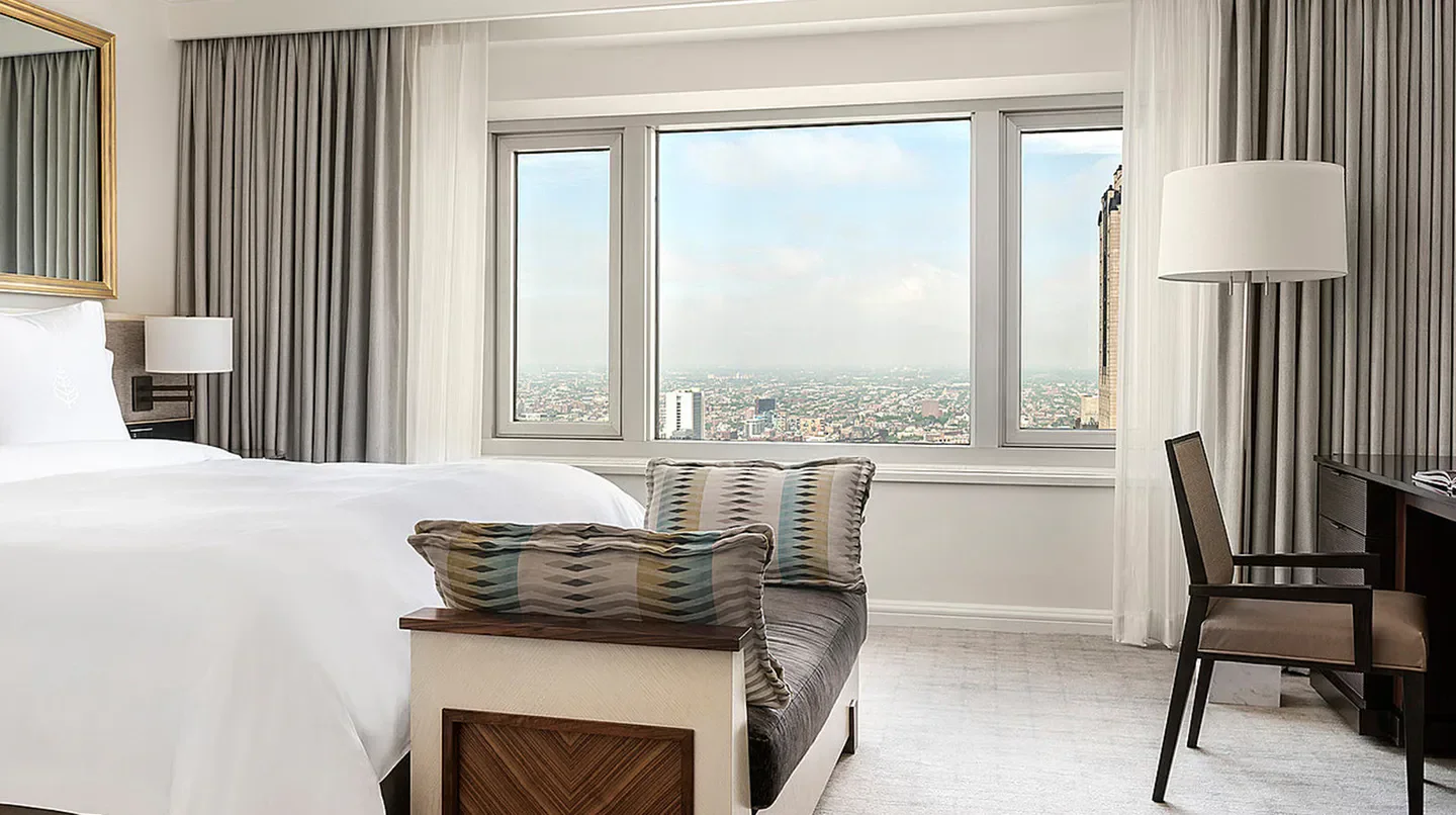 Four Seasons Hotel Chicago guest room with city views in Chicago, Illinois.