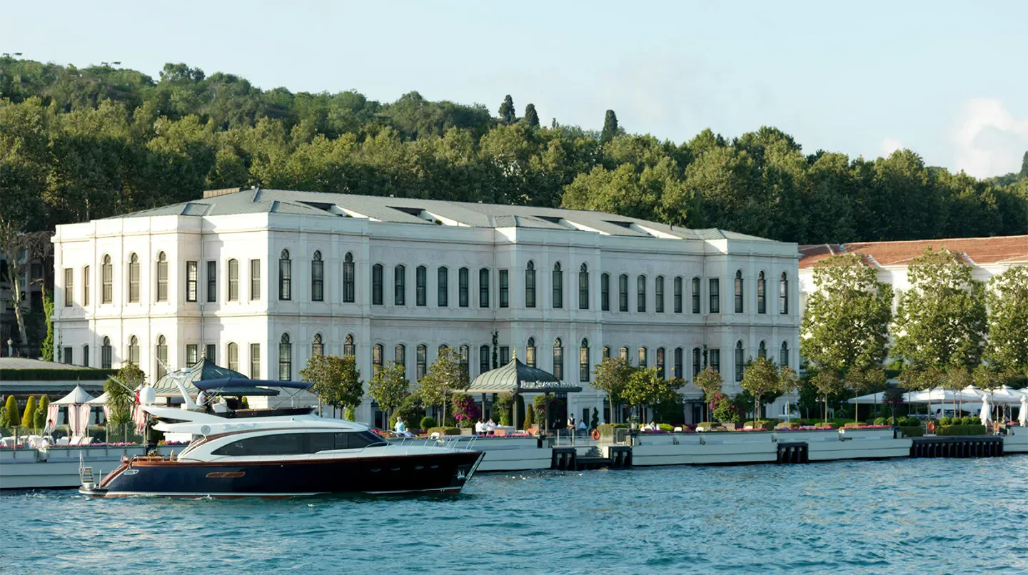 Waterfront view of Four Seasons Hotel Istanbul at the Bosphorus in Istanbul with a boat