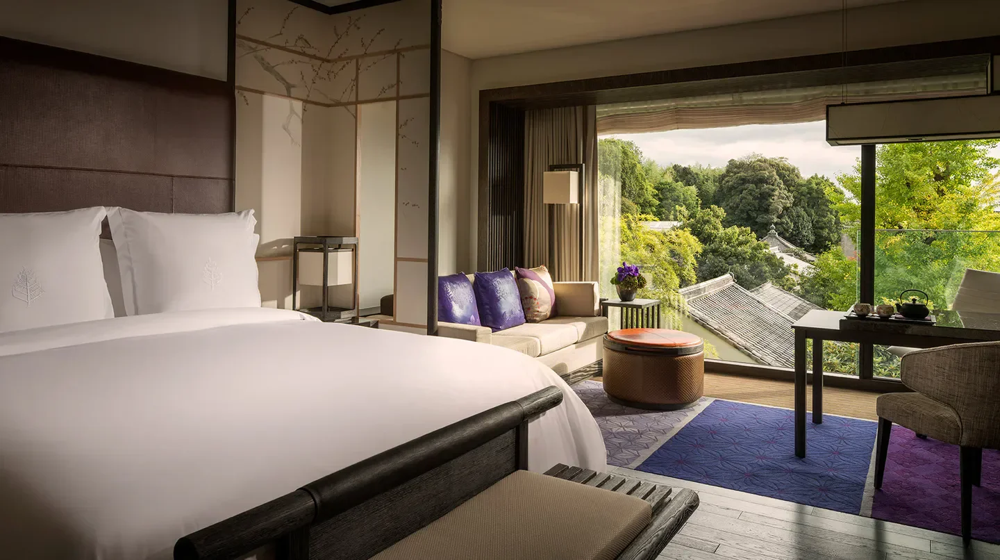 Luxurious Four Seasons Hotel Kyoto bedroom with scenic views of Kyoto.