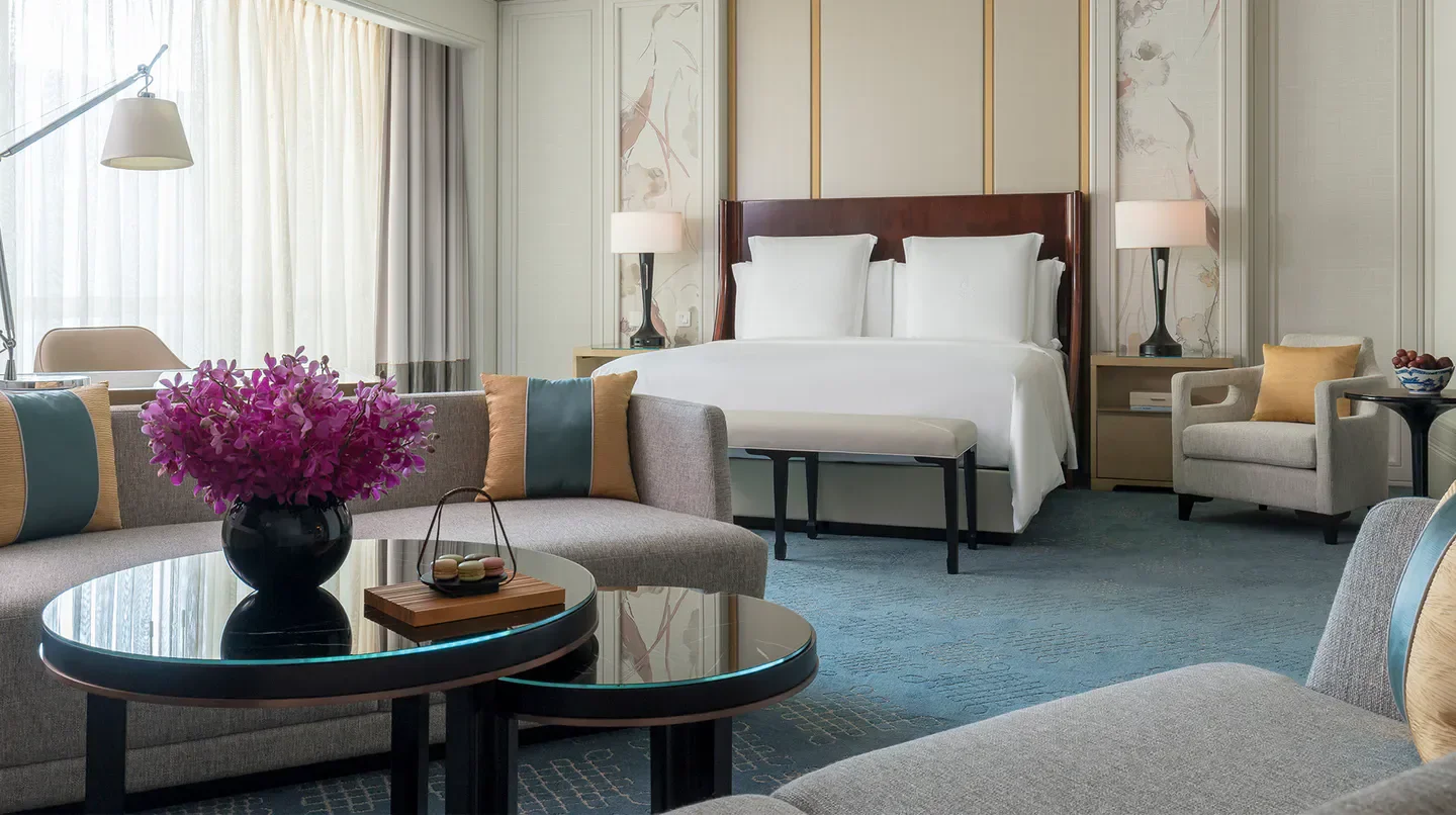 Elegant hotel suite at Four Seasons Hotel Macao, Cotai Strip, offering comfort and luxury.