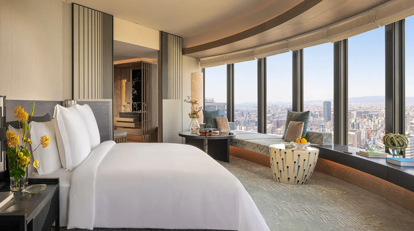Luxury bedroom at Four Seasons Hotel Osaka with stunning city views of Osaka.