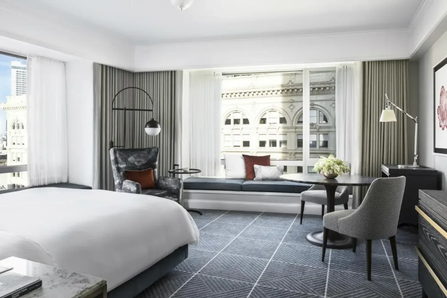 Spacious guest room at Four Seasons Hotel San Francisco, overlooking San Francisco.