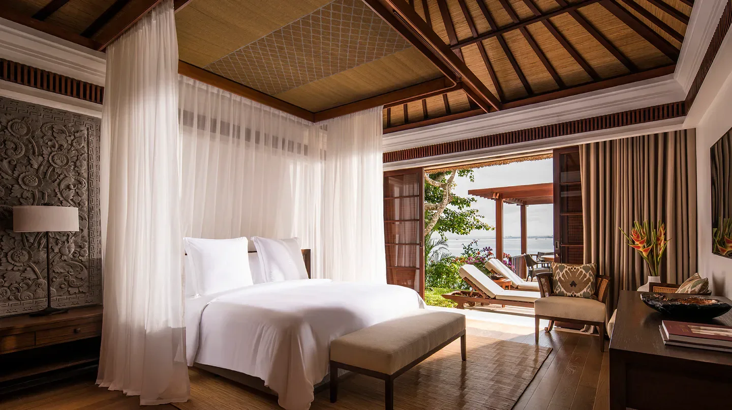 Luxury bedroom at Four Seasons Resort Bali at Jimbaran Bay, Bali, with ocean view.