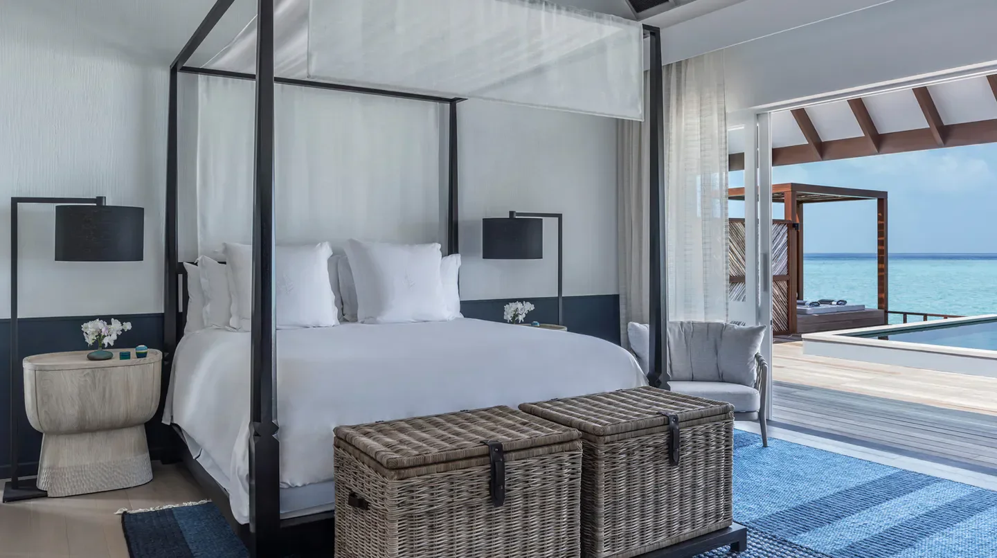 Elegant bedroom at Four Seasons Resort Maldives at Landaa Giraavaru, Maldives, with ocean views