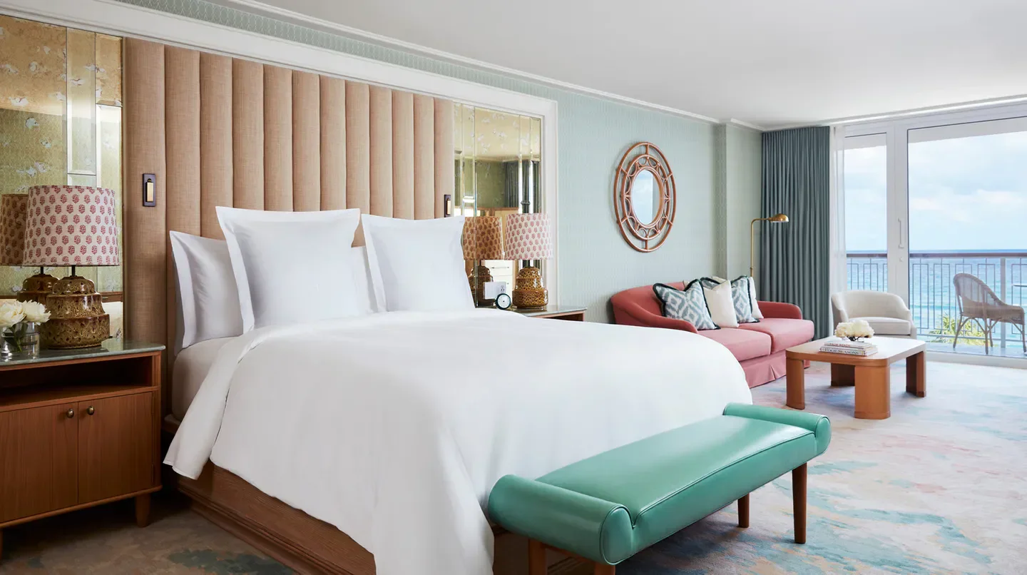 Elegant bedroom at Four Seasons Resort Palm Beach, offering ocean views in Palm Beach, Florida.