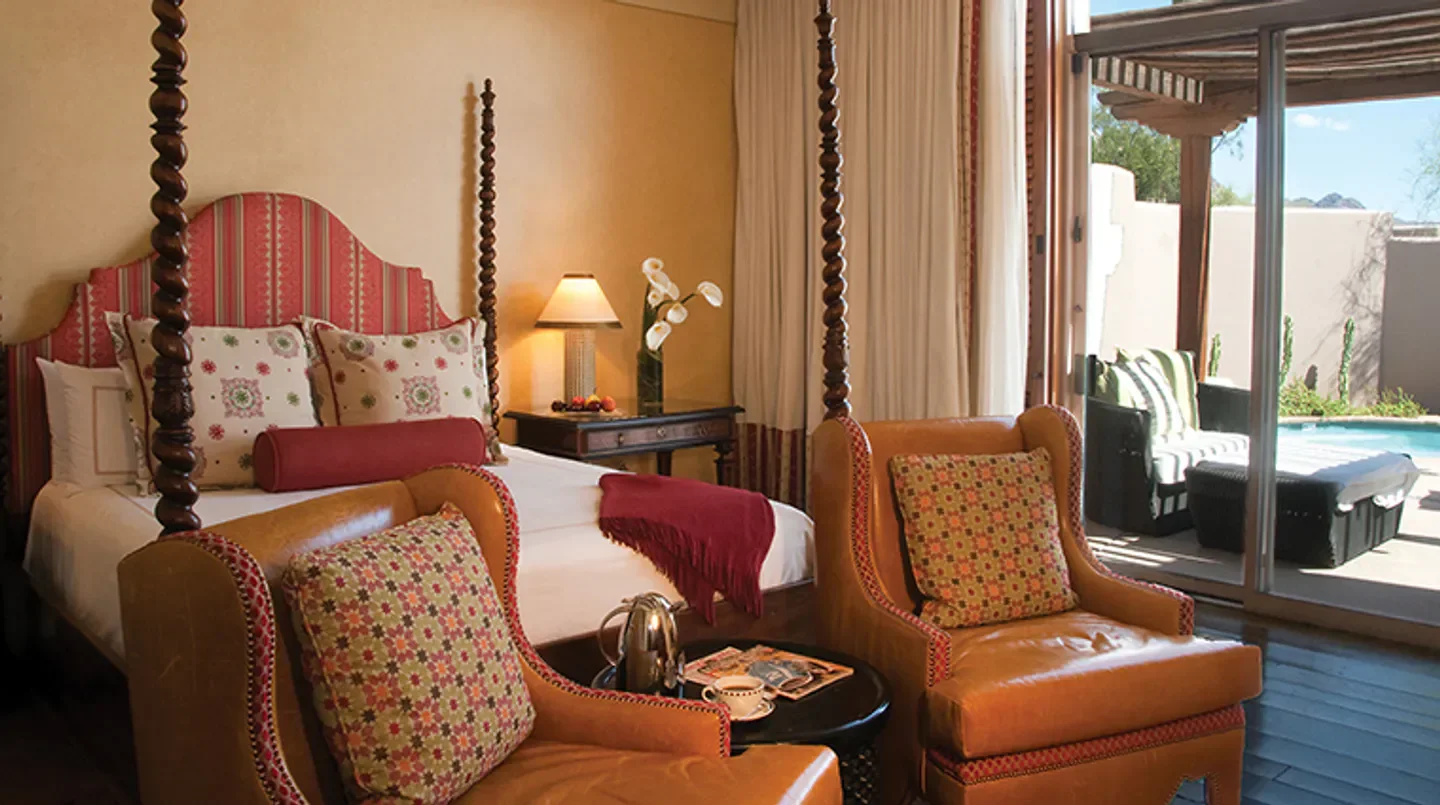Cozy bedroom at Four Seasons Resort Scottsdale at Troon North, with patio and pool views