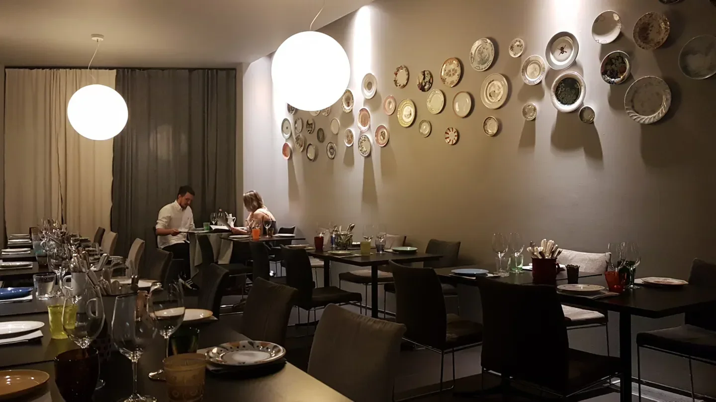 Interior of Franceschetta58 restaurant in Modena, with stylish decor and wall art
