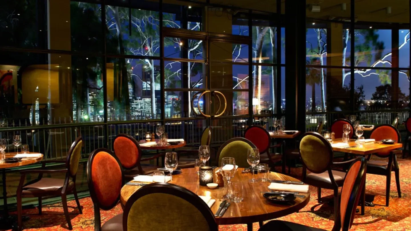 Elegant dining room at Fraser's Restaurant in Perth with city views at night