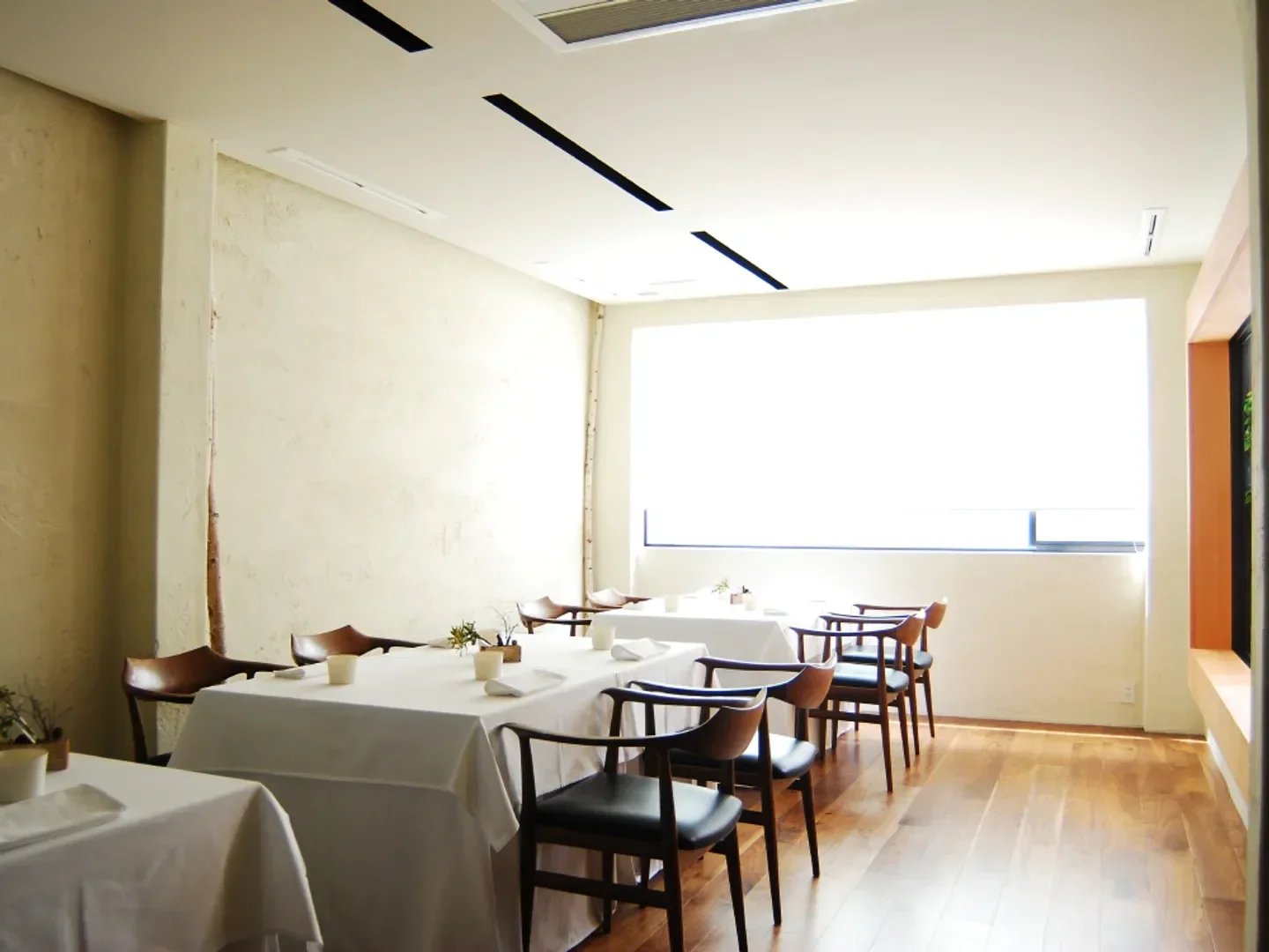 Elegant dining room interior at Fujiya 1935 restaurant in Osaka with modern decor