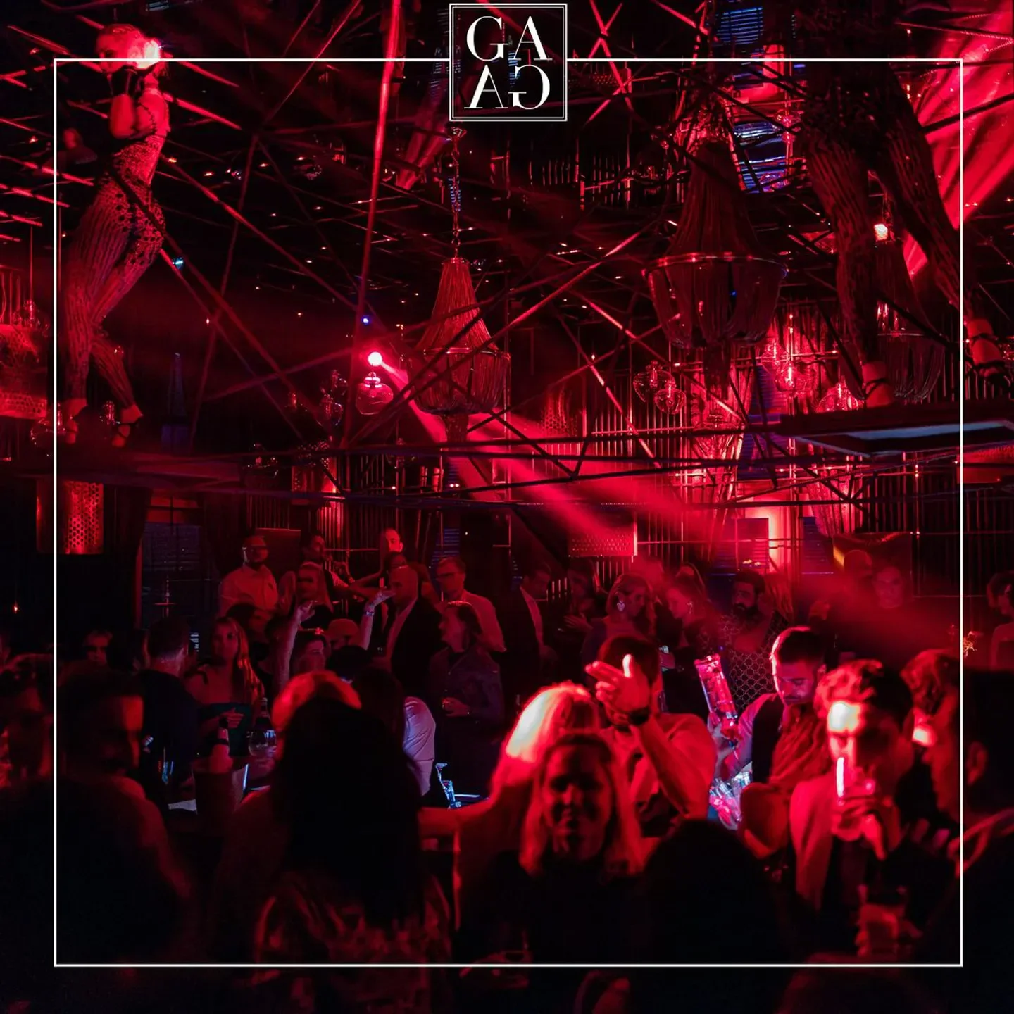 Inside GAGA nightclub in Hamburg, with red lighting and a lively crowd.