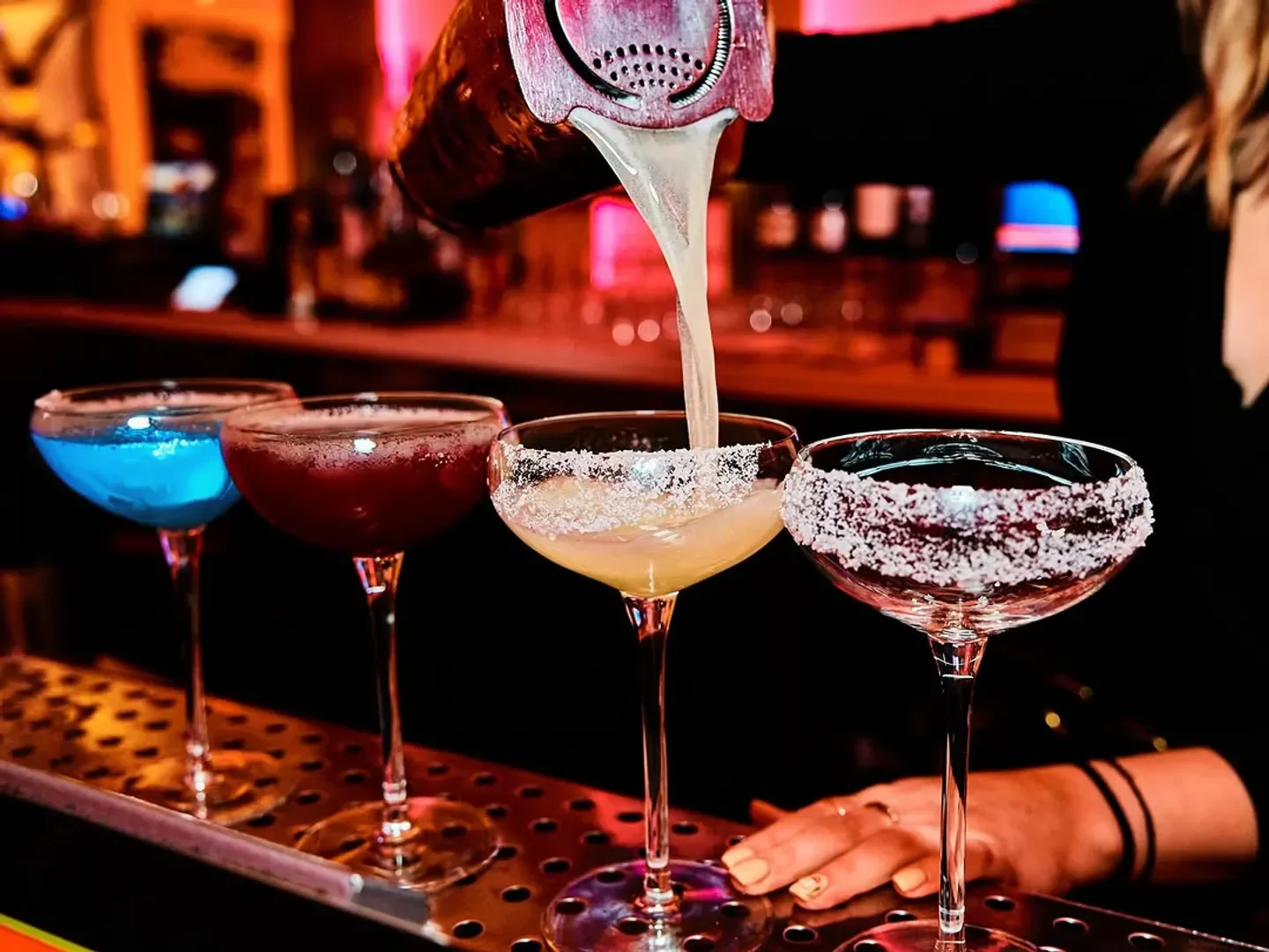 Cocktails being poured at Gatsby nightclub in Las Vegas, a vibrant nightlife destination.