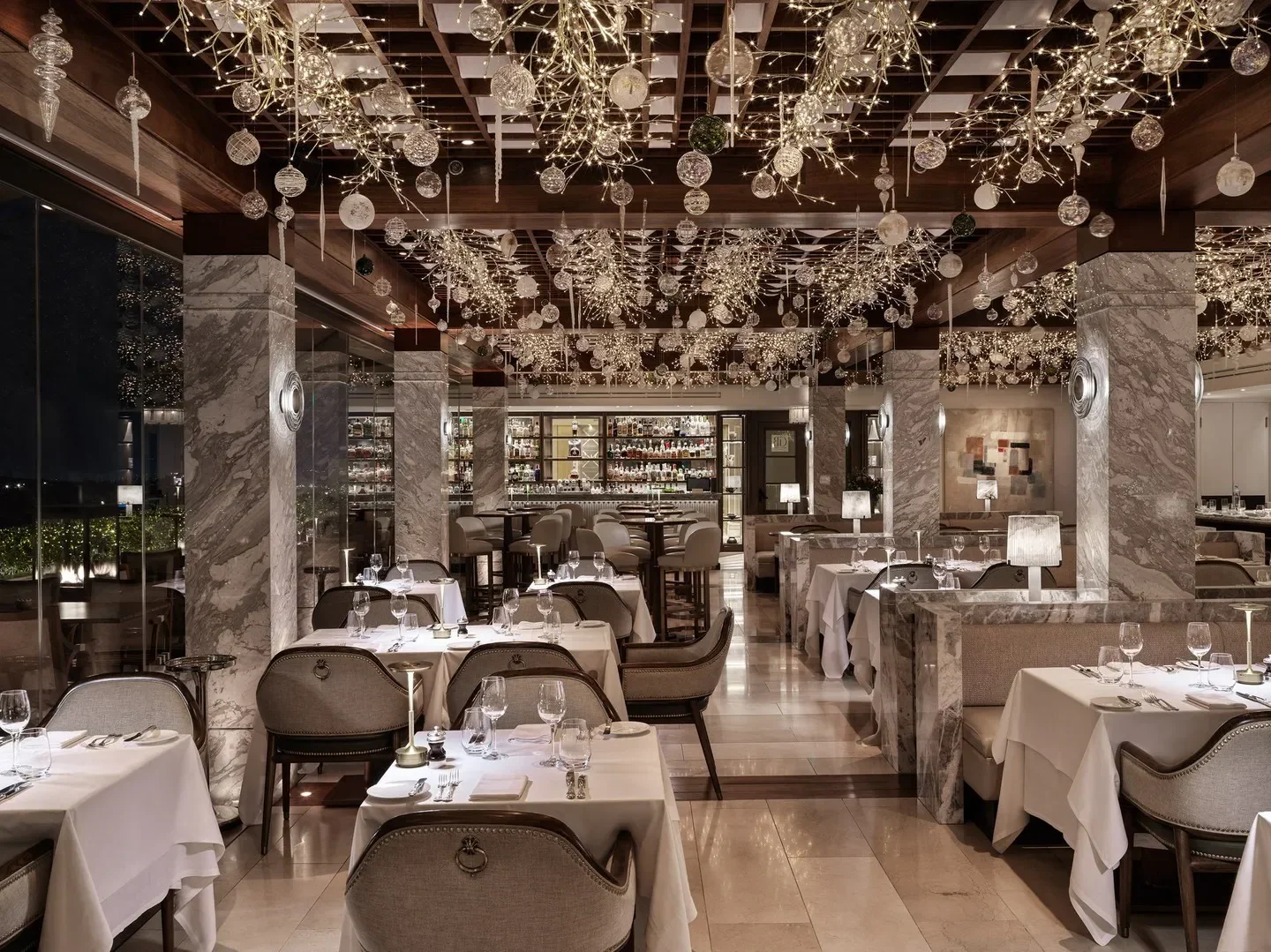 Elegant interior of GB Roof Garden Restaurant in Athens, with festive decorations and a bar