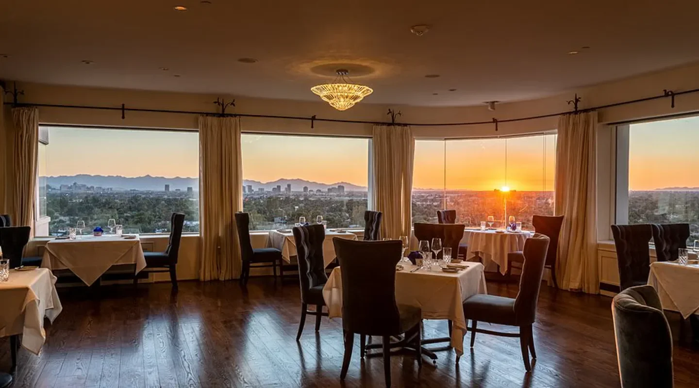 Dining room at Geordie's in Phoenix with sunset views over the city