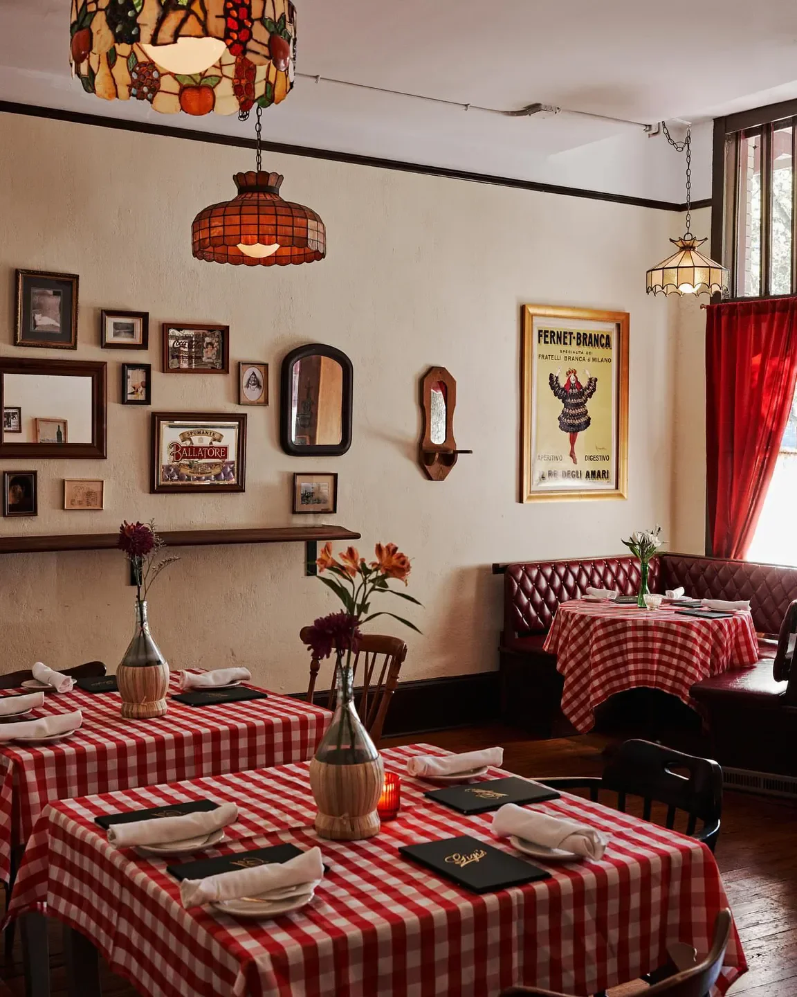Cozy dining room at Gigi's Italian in Atlanta with checkered tablecloths and decor.