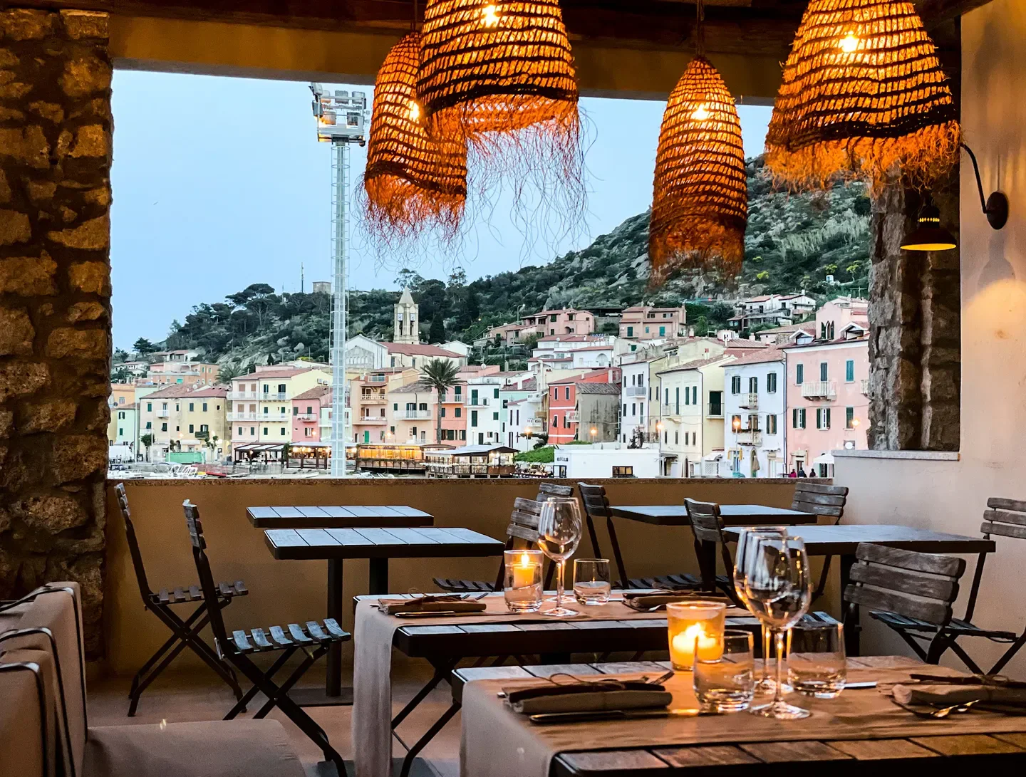 Dining with a view at Giglio, Tuscany, featuring sea view and stylish decor.