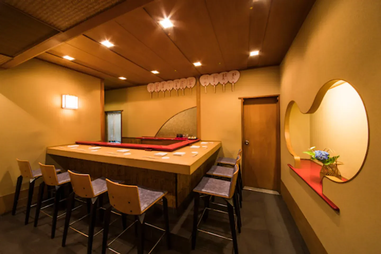 Interior of Gion Nishimura restaurant in Kyoto, with counter and stylish seating.