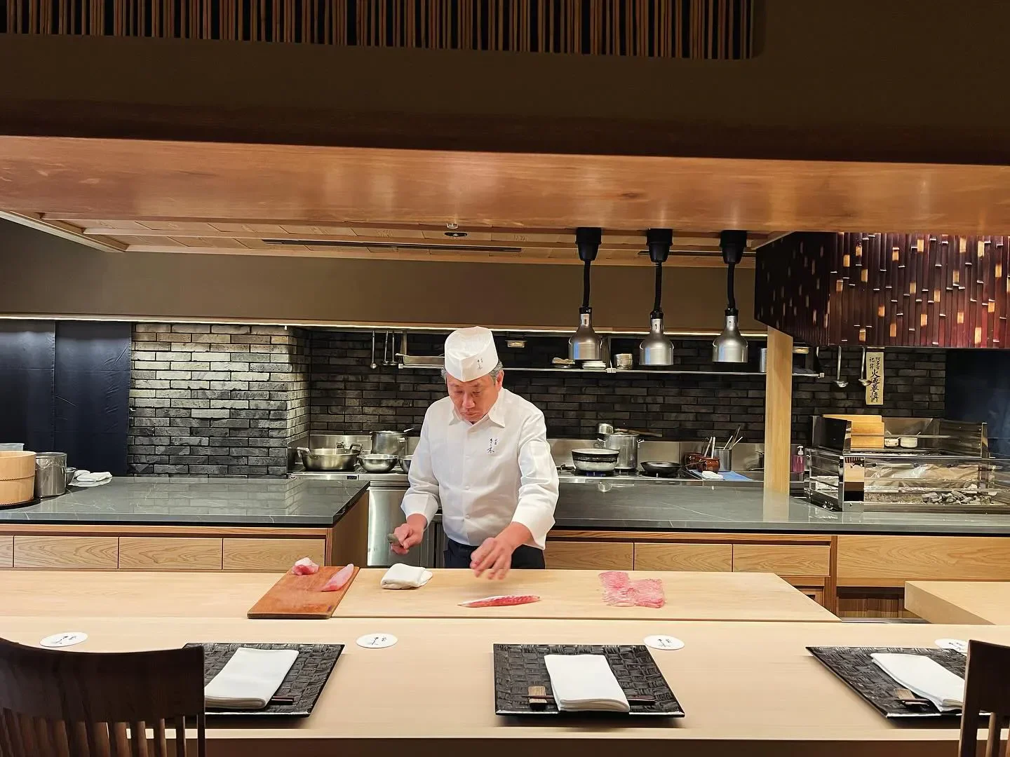Chef preparing sushi at Gion Sasaki restaurant in Kyoto, showcasing Japanese cuisine.